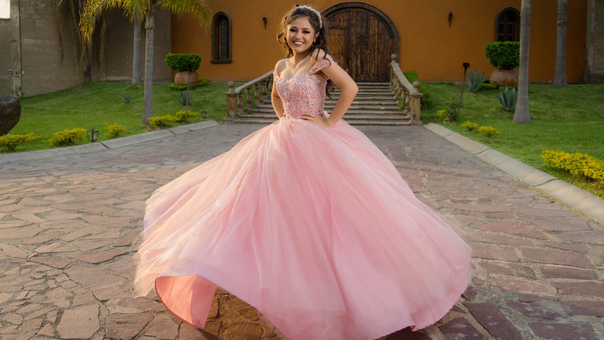 pink quinceanera gown, stone courtyard path, warm-toned mansion, Full HD Desktop Wallpaper
