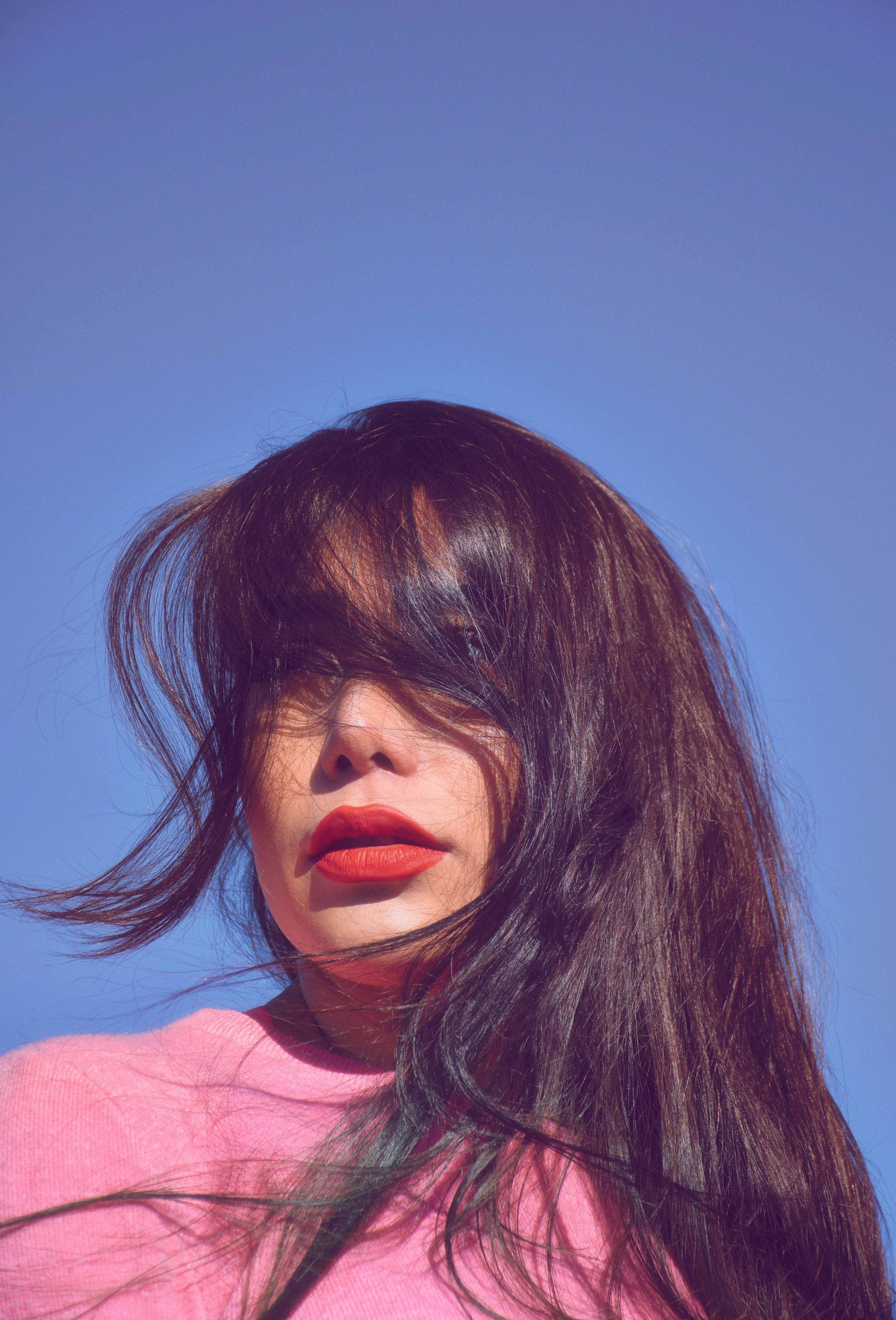Pink Girl iPhone, skyline, dark hair, 5K Phone Wallpaper