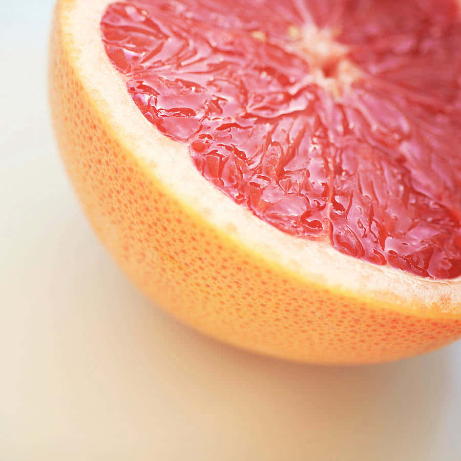 Pink Grapefruit, juicy pink segments, soft white background, SD Desktop Wallpaper