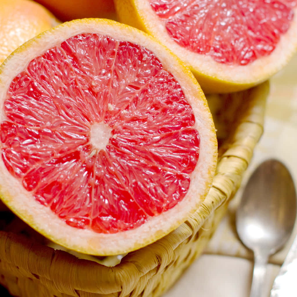 Pink Grapefruit, vibrant red grapefruit halves, woven basket, SD Desktop Wallpaper