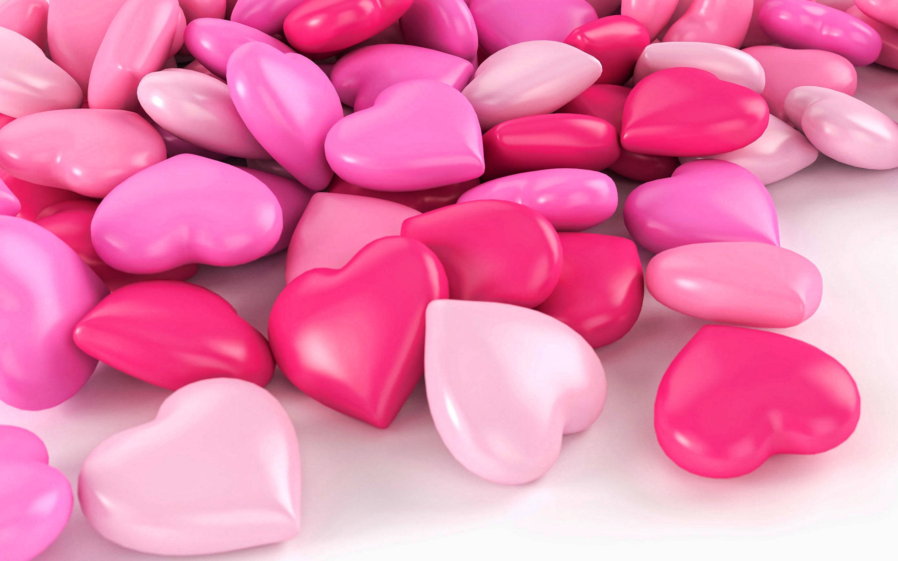 pink heart-shaped candies, glossy, vibrant, 2K Desktop Wallpaper
