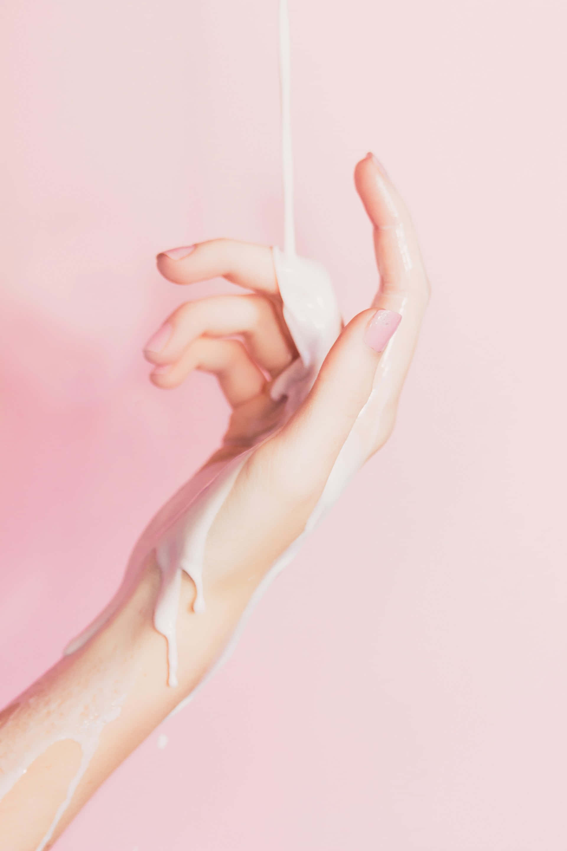 hand cream, creamy white liquid, soft pink background, 2K Phone Wallpaper
