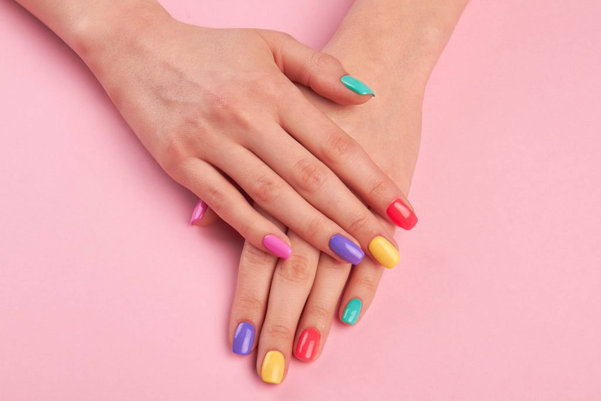 rainbow-colored nails, soft pink background, close-up shot, Full HD Desktop Wallpaper