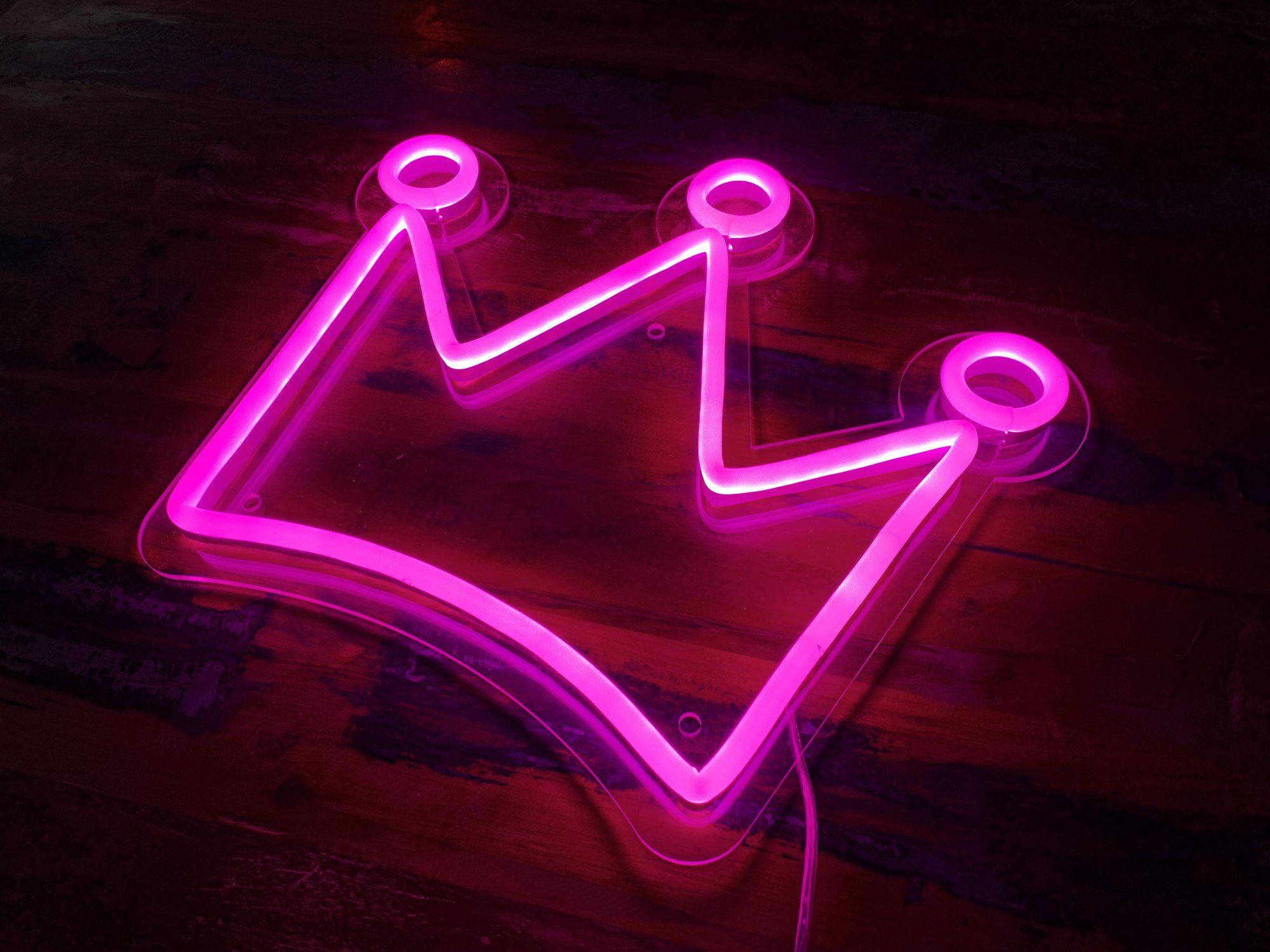 Pink Neon Aesthetic, glowing pink neon crown sign, dark wooden surface, Full HD Desktop Wallpaper