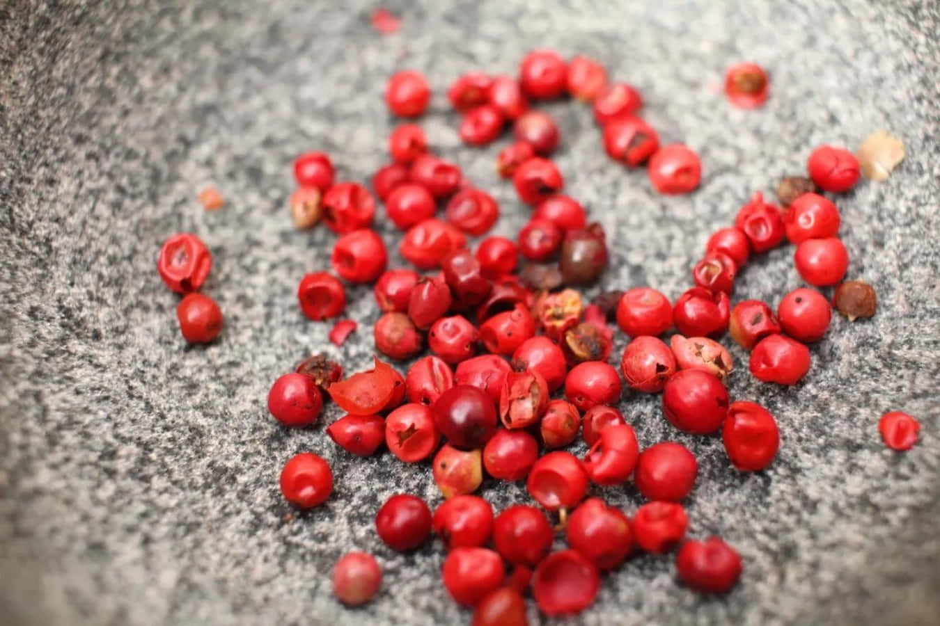Pink Peppercorn, red peppercorns, textured gray stone surface, HD Desktop Wallpaper