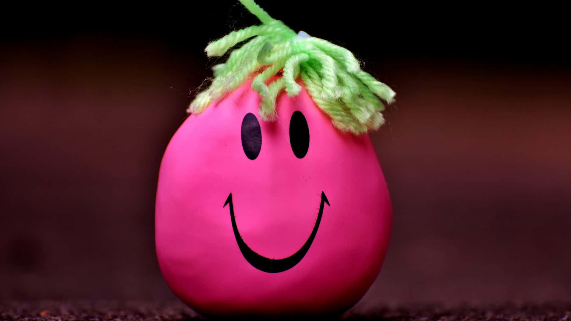 Pink Smiley Ball, green yarn hair, cheerful smiley face, Full HD Desktop Wallpaper
