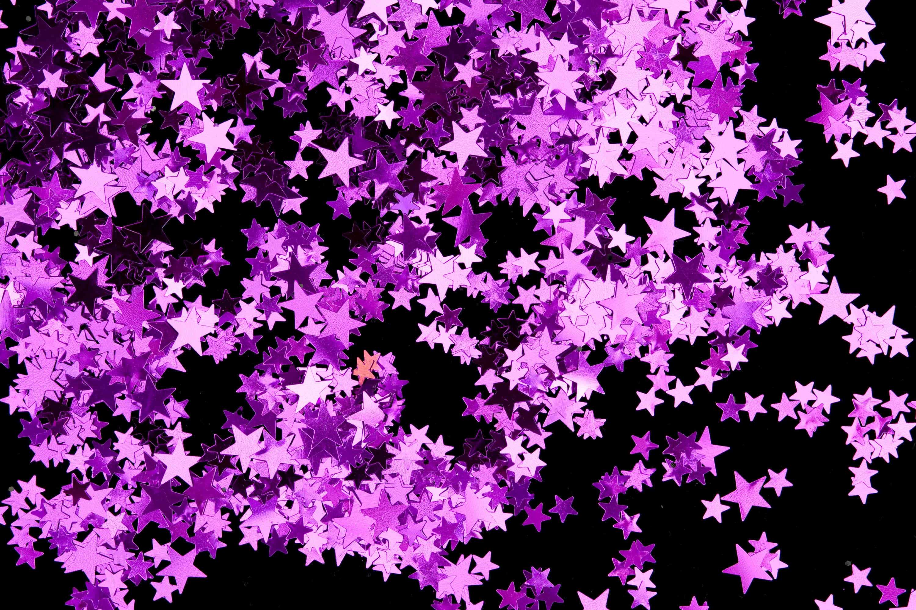 Pink Stars, shimmering purple star-shaped confetti, stark black background, 2K Desktop Wallpaper
