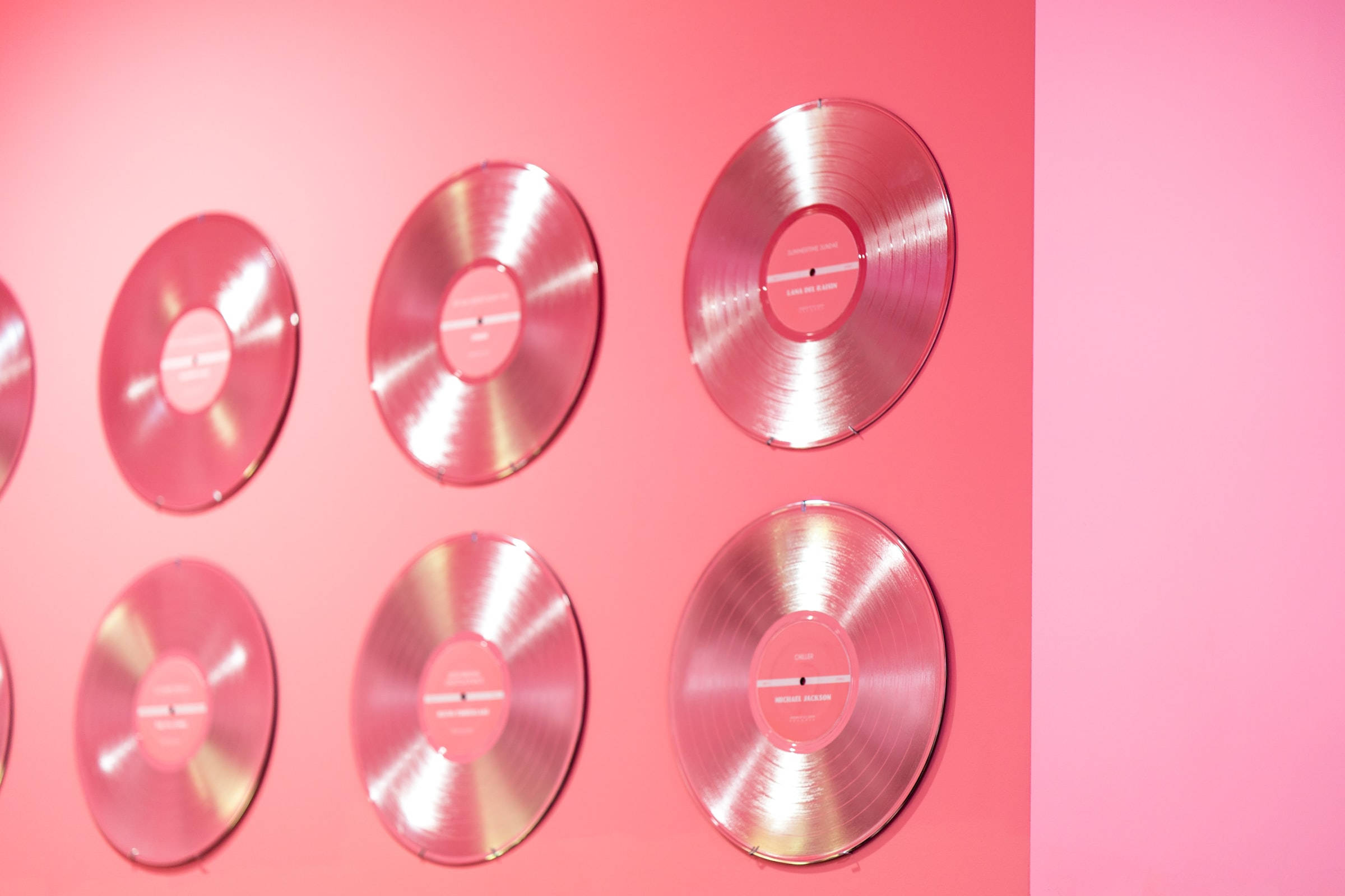 pink vinyl records, solid pink wall, modern minimalist display, Full HD Desktop Wallpaper