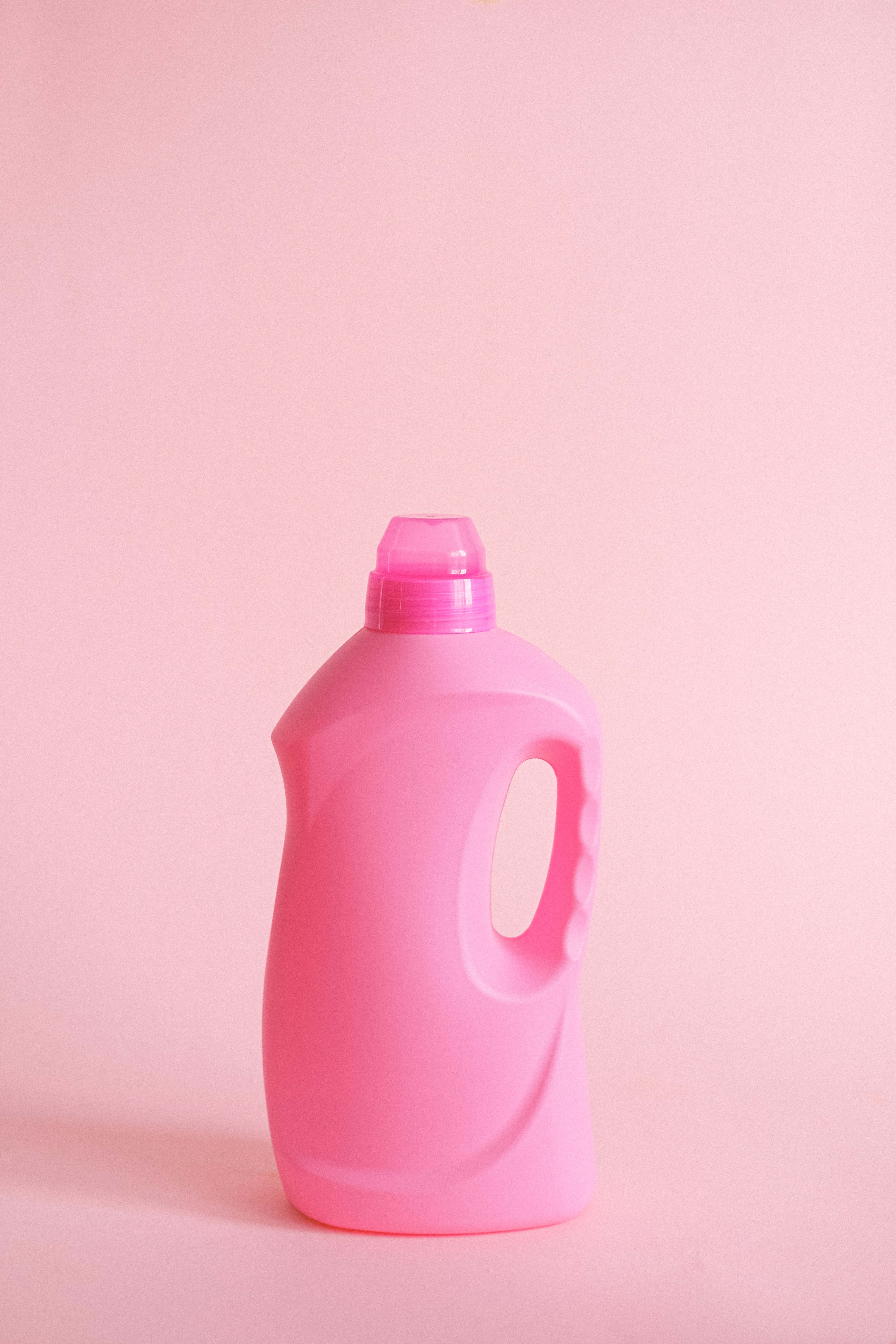 antiseptic pink, plastic laundry detergent bottle, pastel pink background, 5K Phone Wallpaper