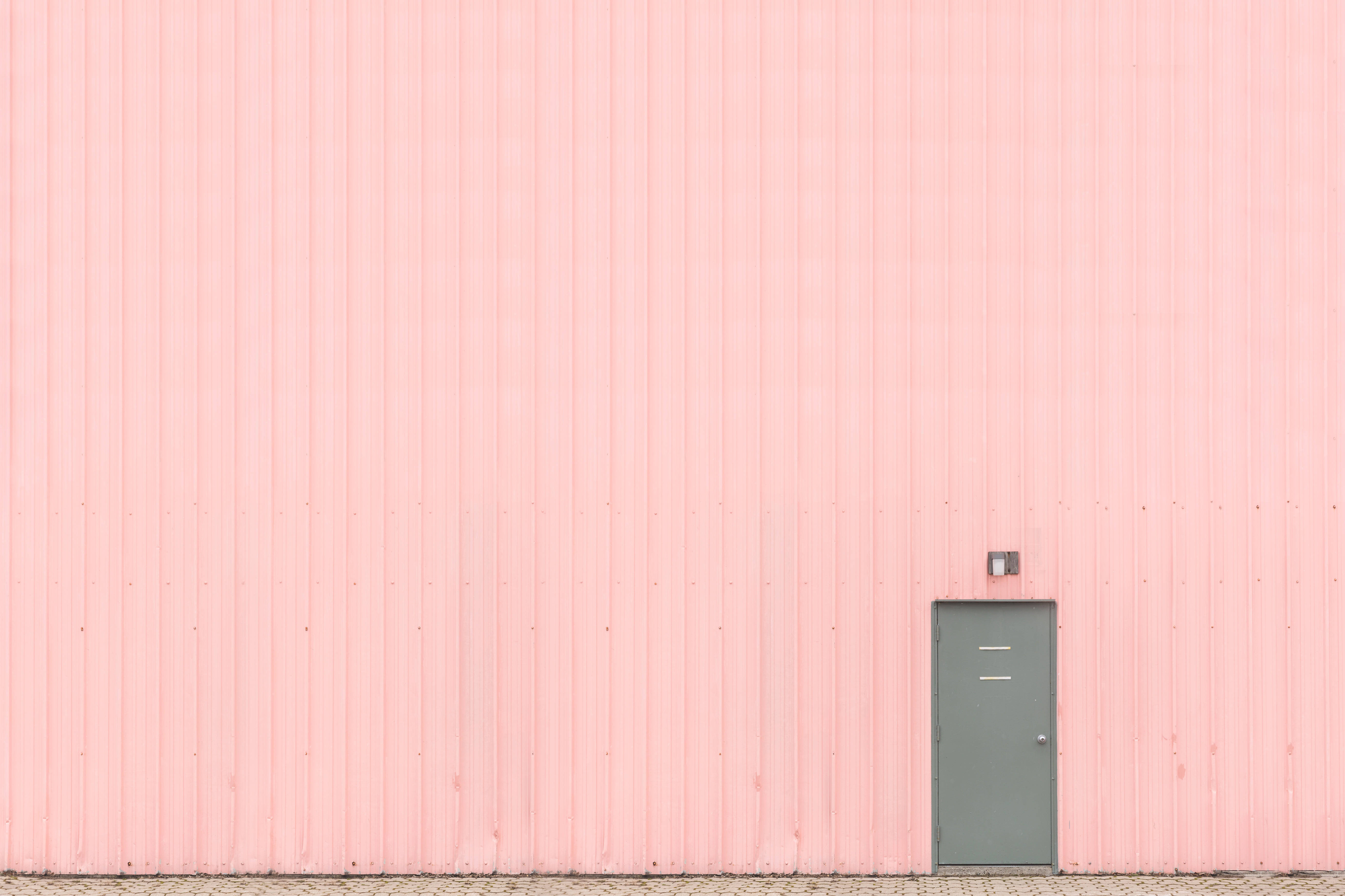 pink corrugated metal wall, small gray door, bottom right, 5K Desktop Wallpaper