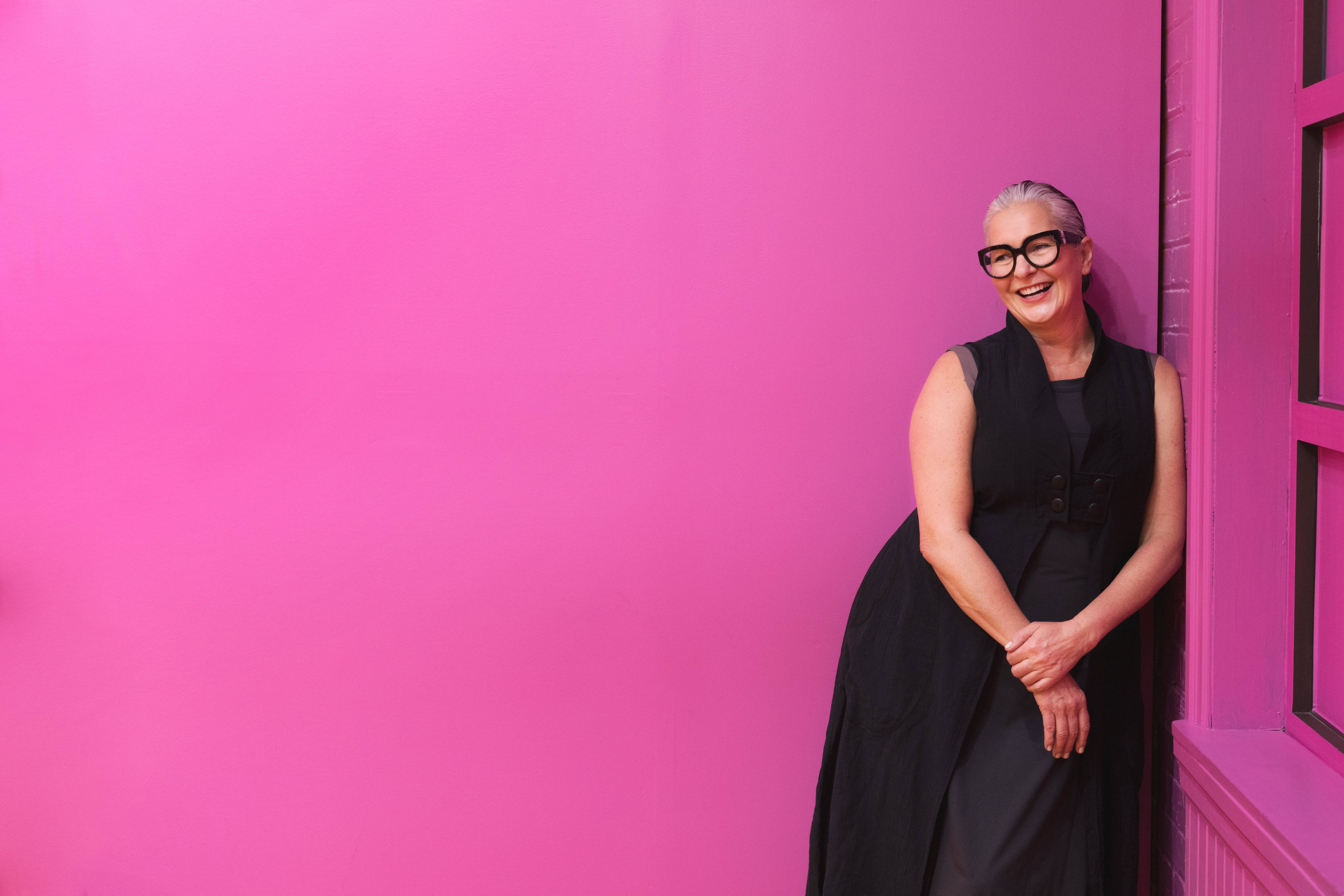 fuchsia pink wall, woman posing, black attire, 5K Desktop Wallpaper