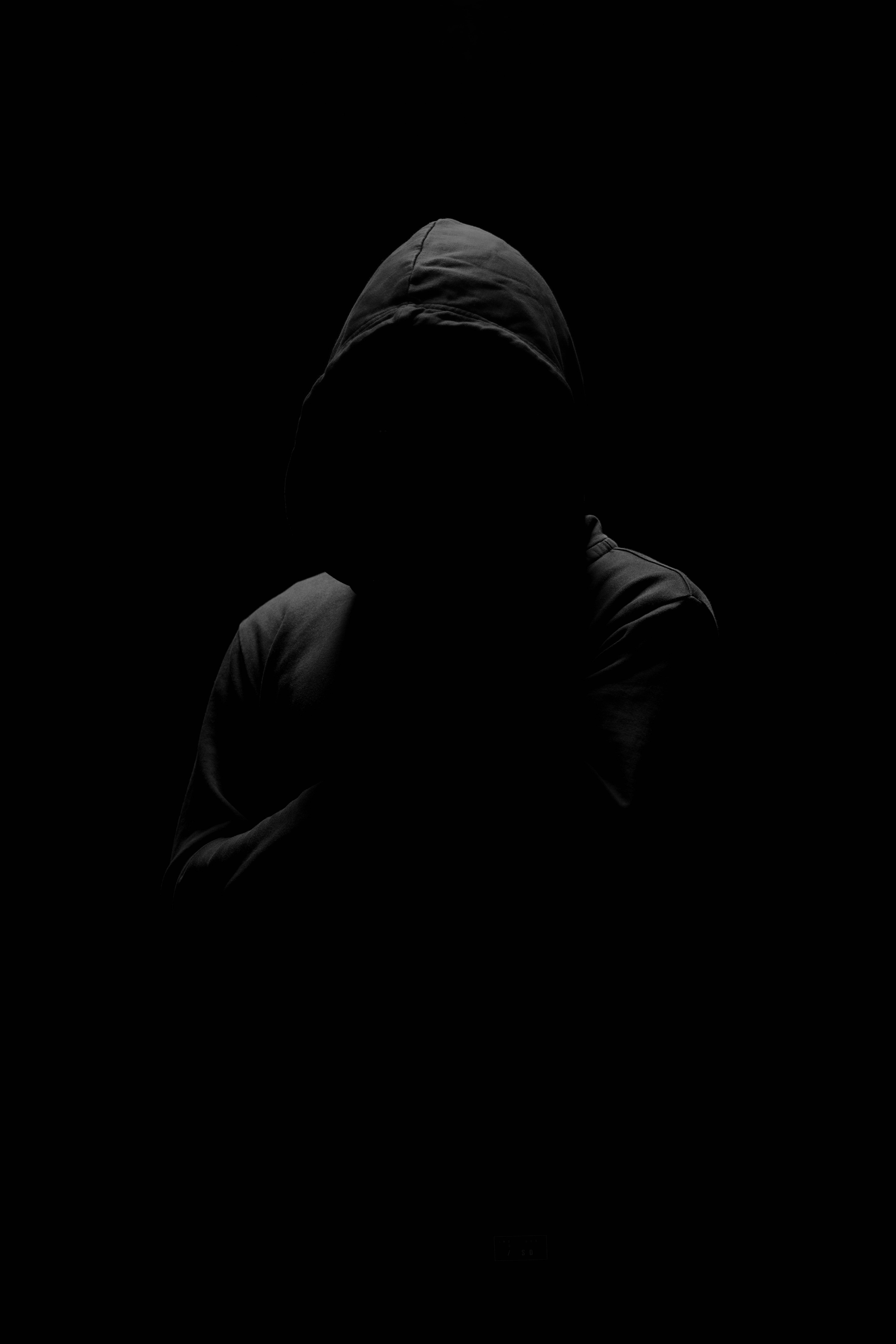 anonymous man, hooded jacket, pitch-black background, 8K Phone Wallpaper