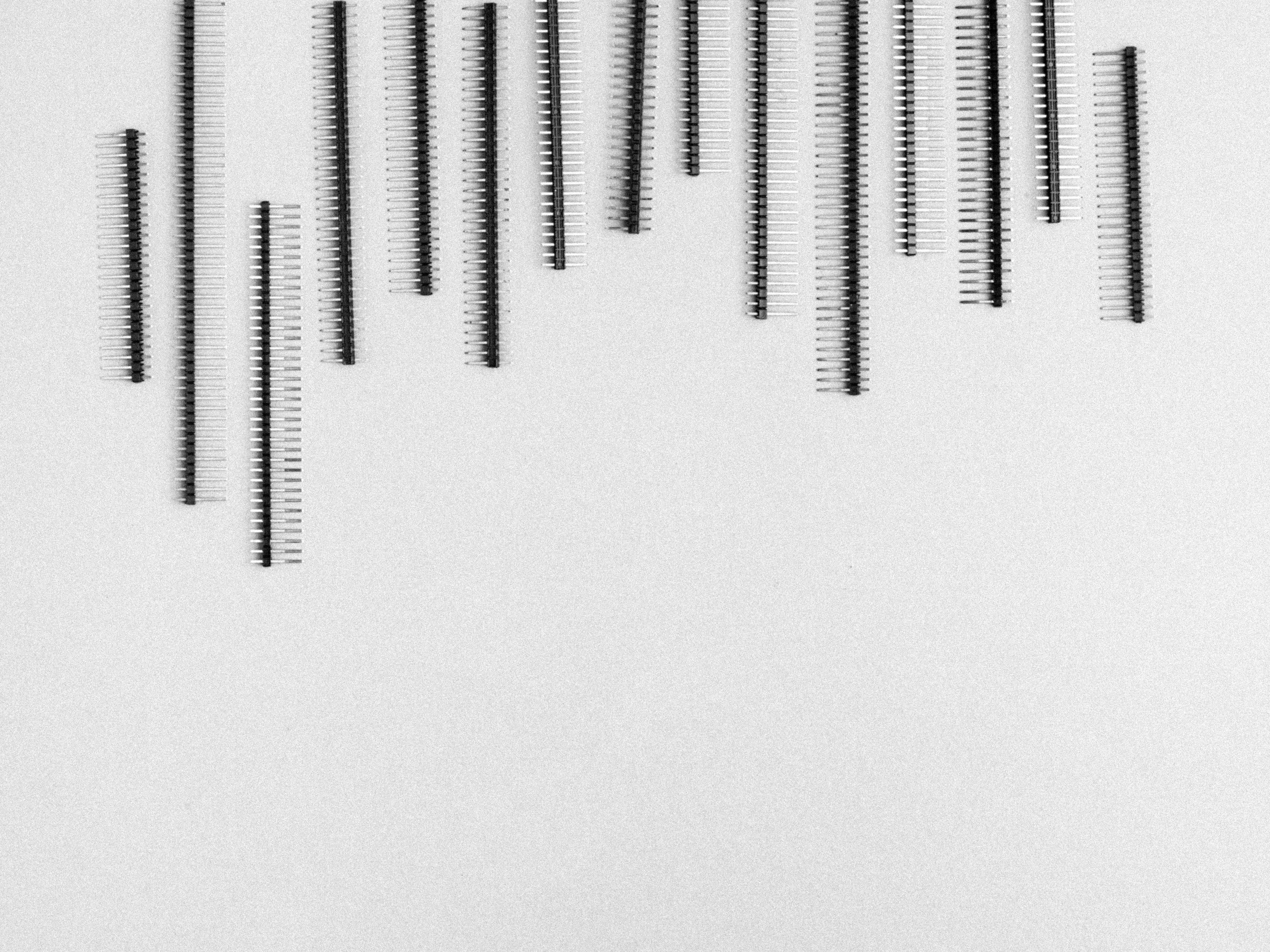 black striped lines, vertical comb-like shapes, textured light gray background, 2K Desktop Wallpaper