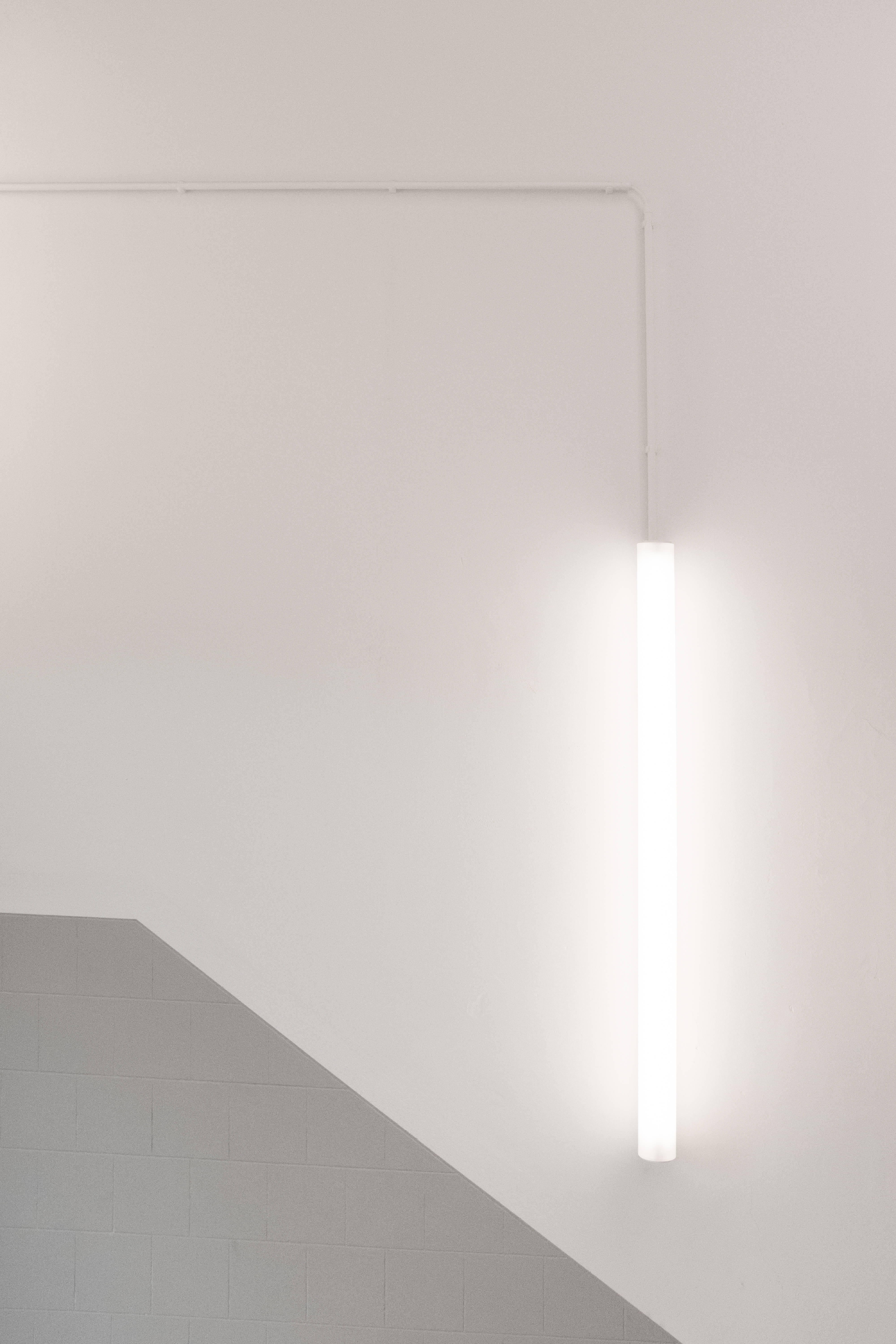 white aesthetic fluorescent light, minimalist vertical fluorescent light fixture, stark white walls, 5K Phone Wallpaper