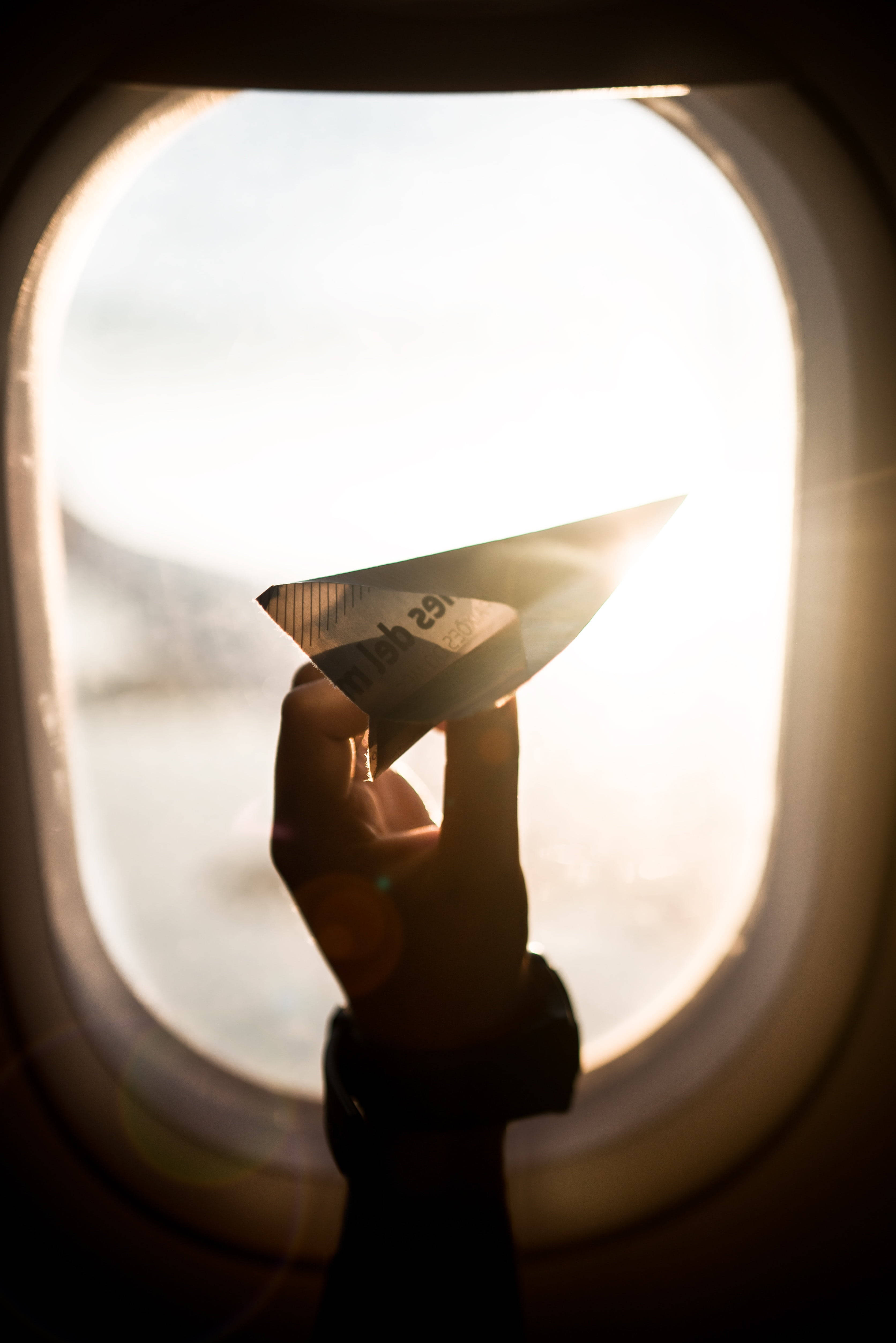 paper airplane, airplane window, sunlight flaring, 4K Phone Wallpaper