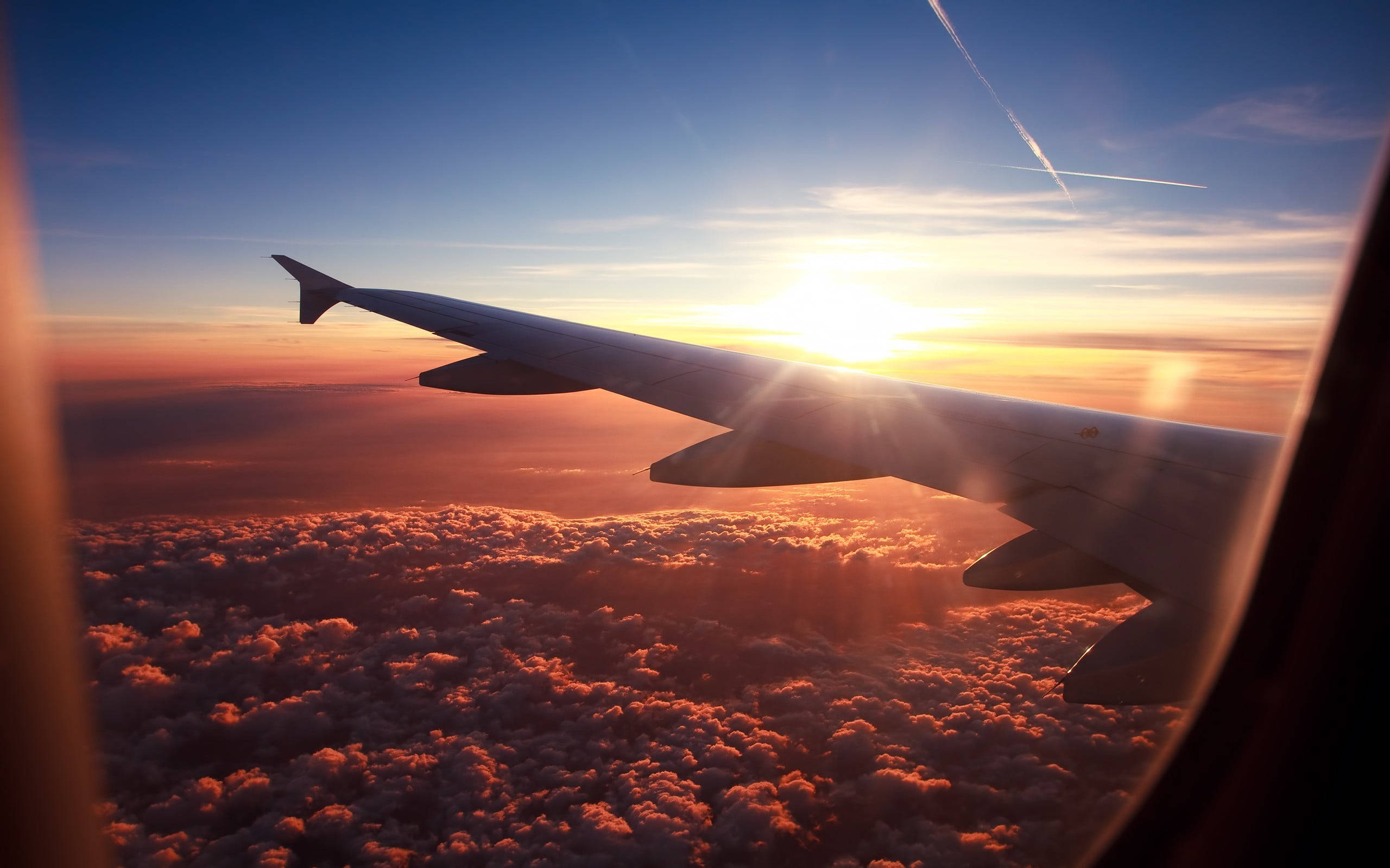 Sunset, airplane wing, sea of orange clouds, 2K Desktop Wallpaper