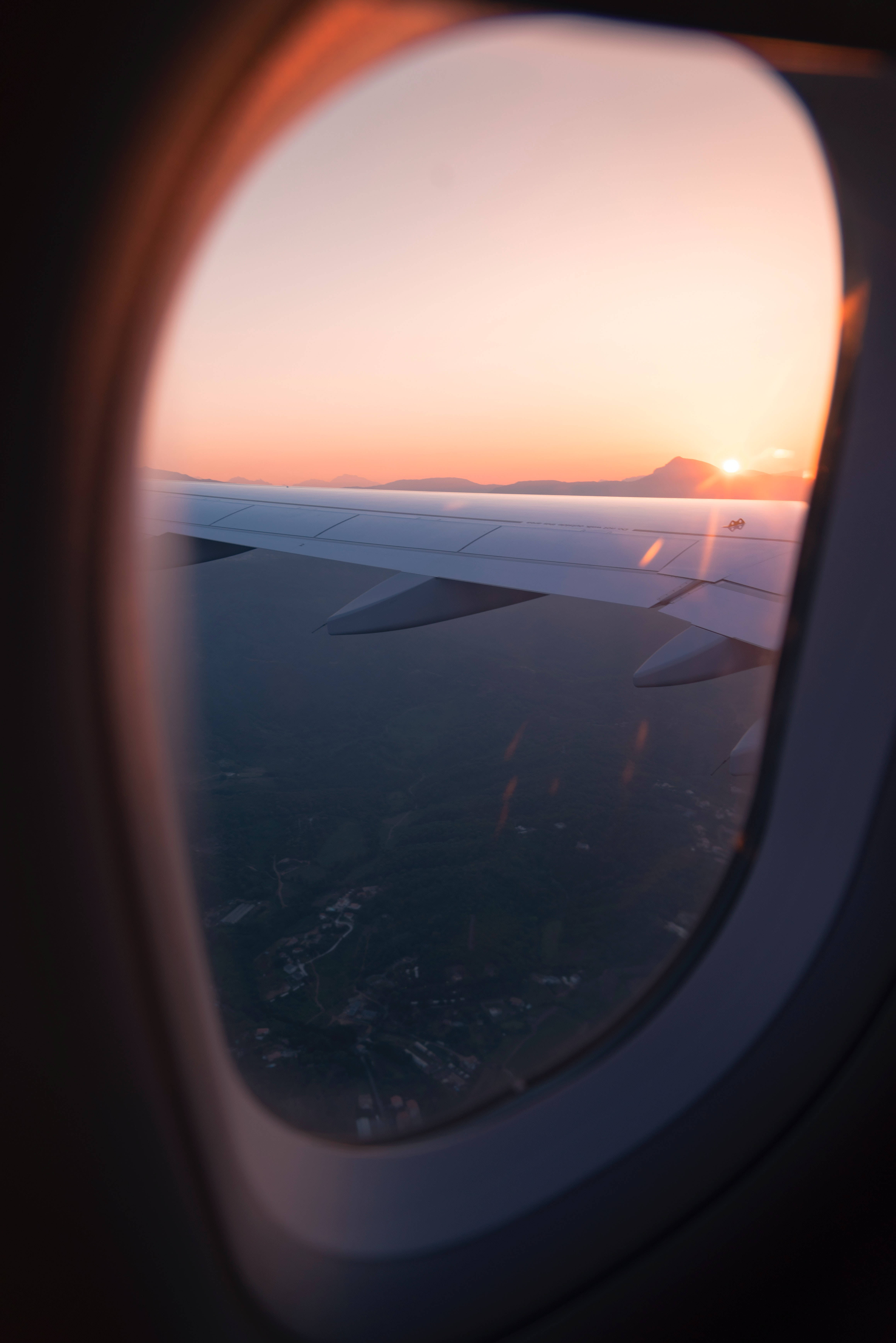 Aircraft wing, vibrant orange sunset, airplane window, 5K Phone Wallpaper