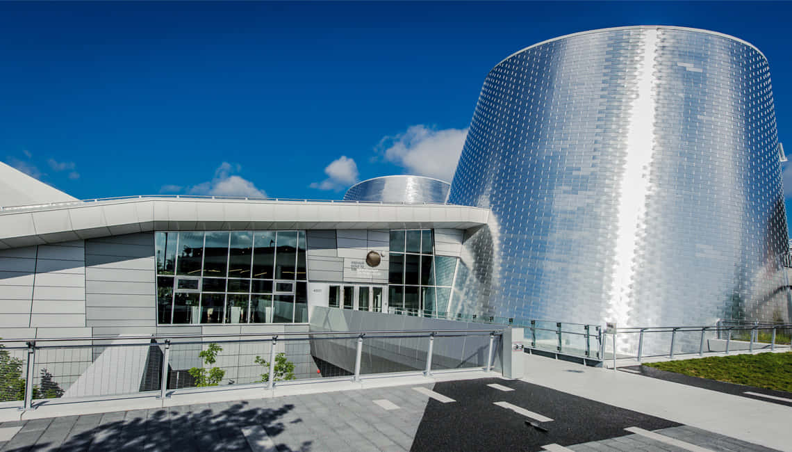 Planetarium, shimmering silver cylindrical tower, glass facade, SD Desktop Wallpaper