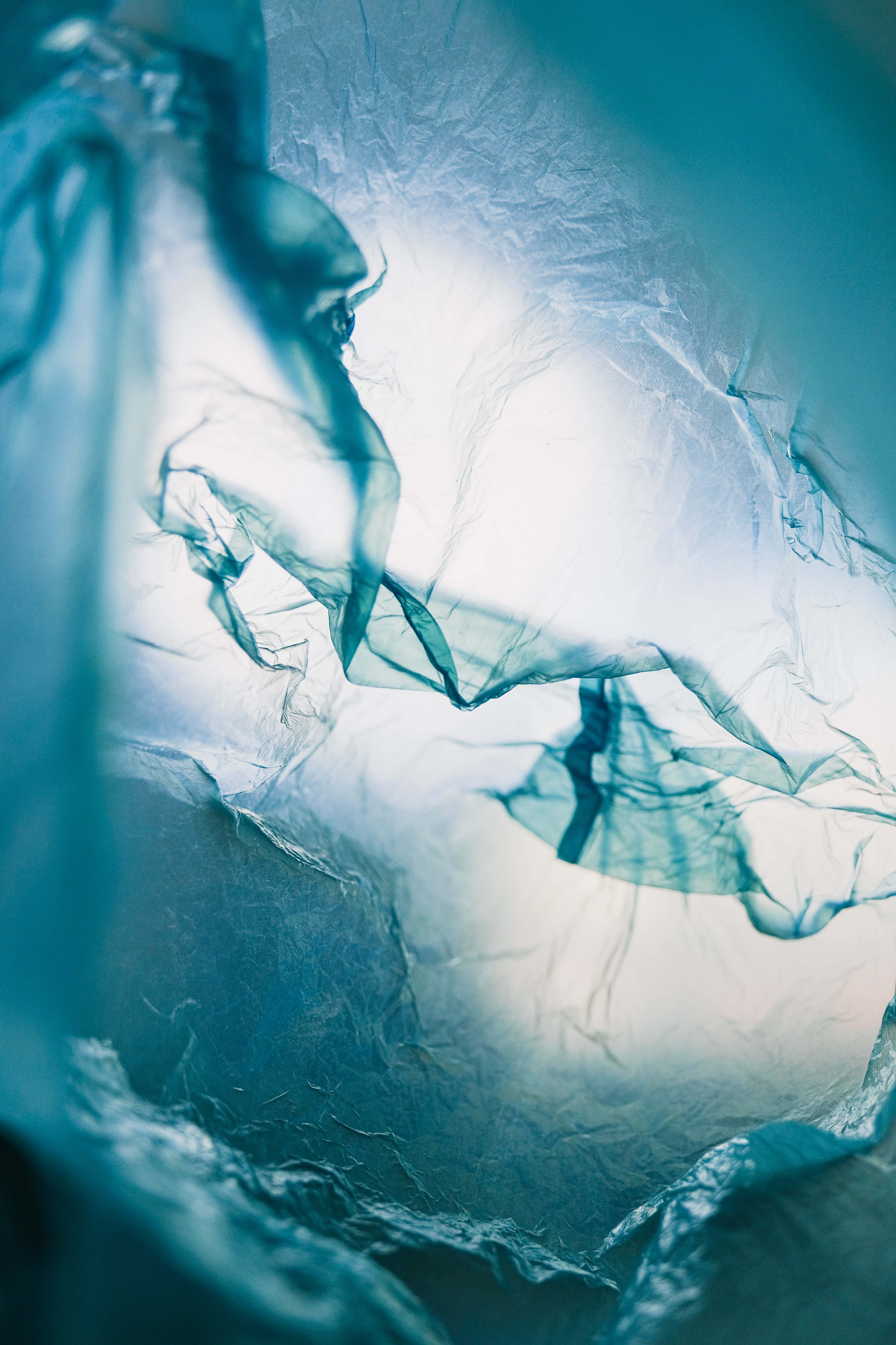 translucent blue plastic film, soft light, abstract folds, 5K Phone Wallpaper
