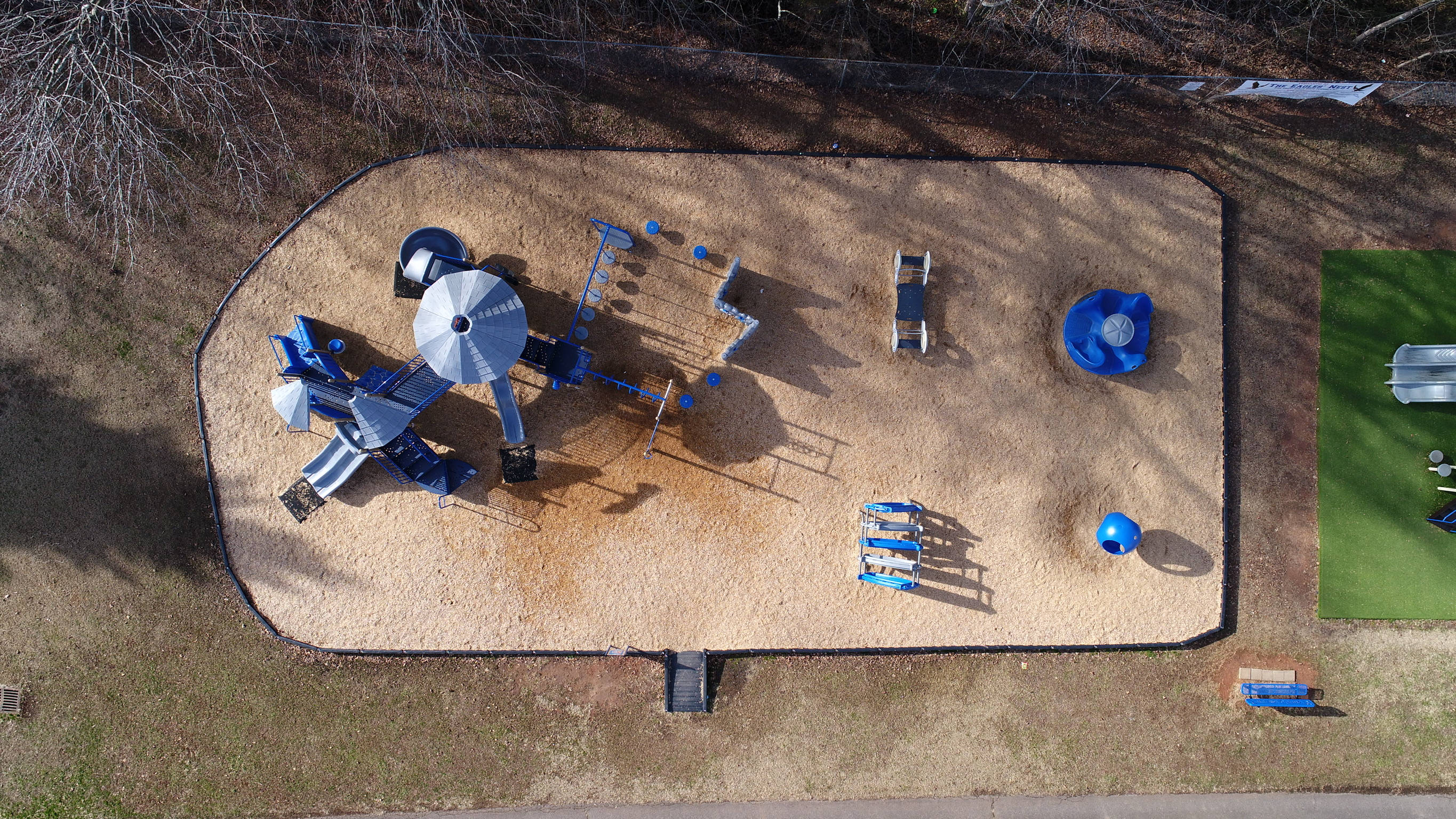 blue playground structure, wood chips, bare trees, 2K Desktop Wallpaper