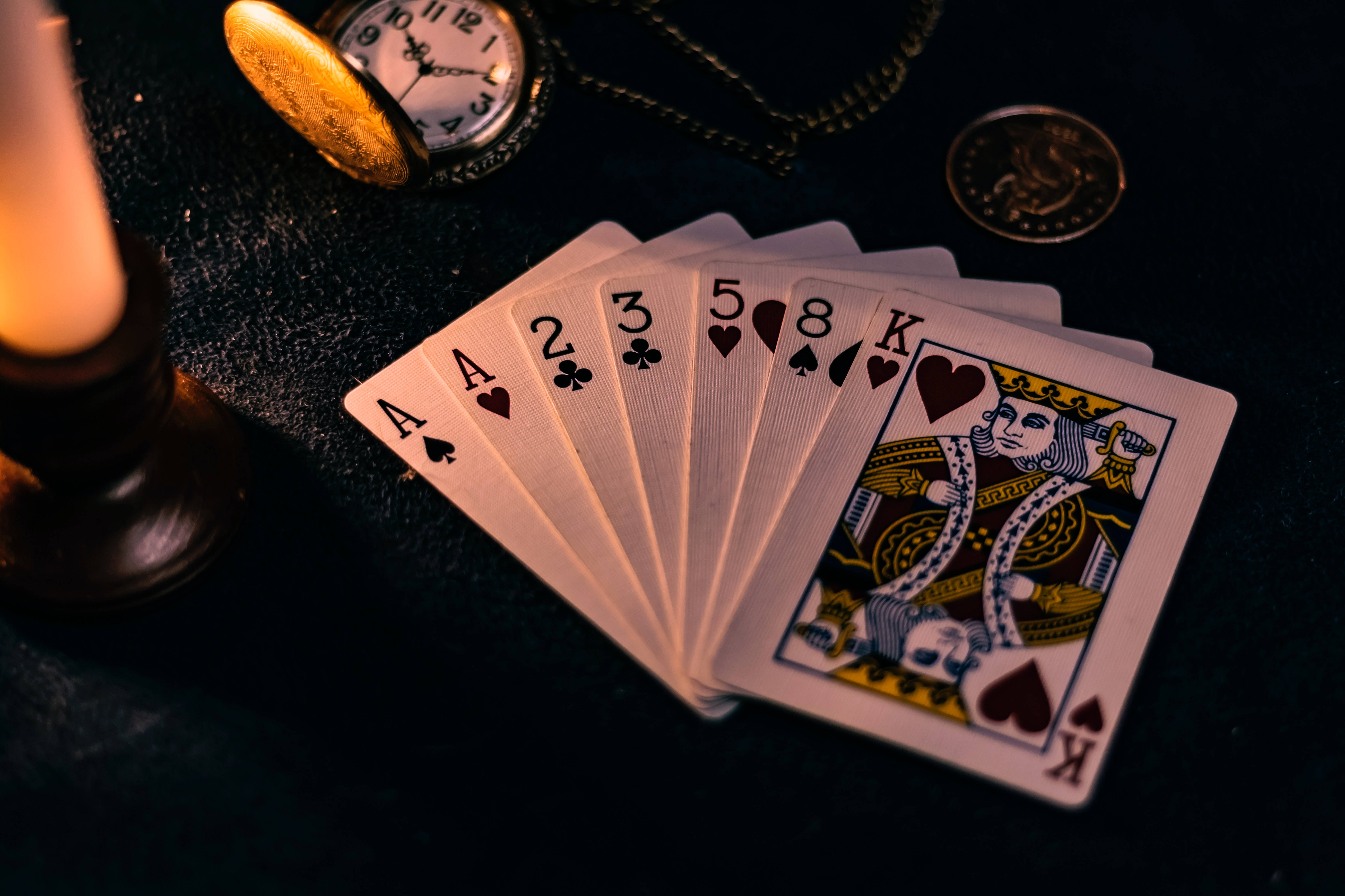 seven rummy playing cards, lit candle pocket watch, coins, 5K Desktop Wallpaper