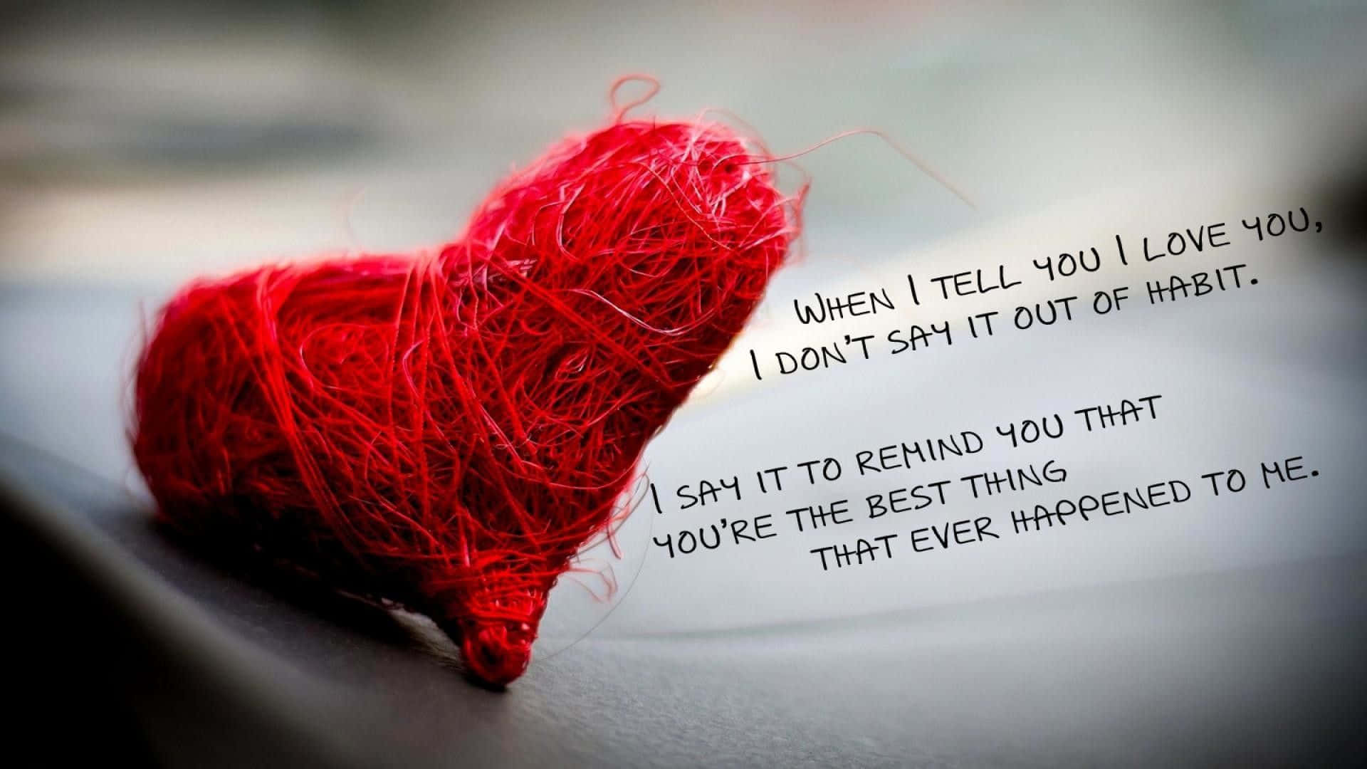 vibrant red yarn heart, handwritten text expressing deep love, soft gray surface, Full HD Desktop Wallpaper