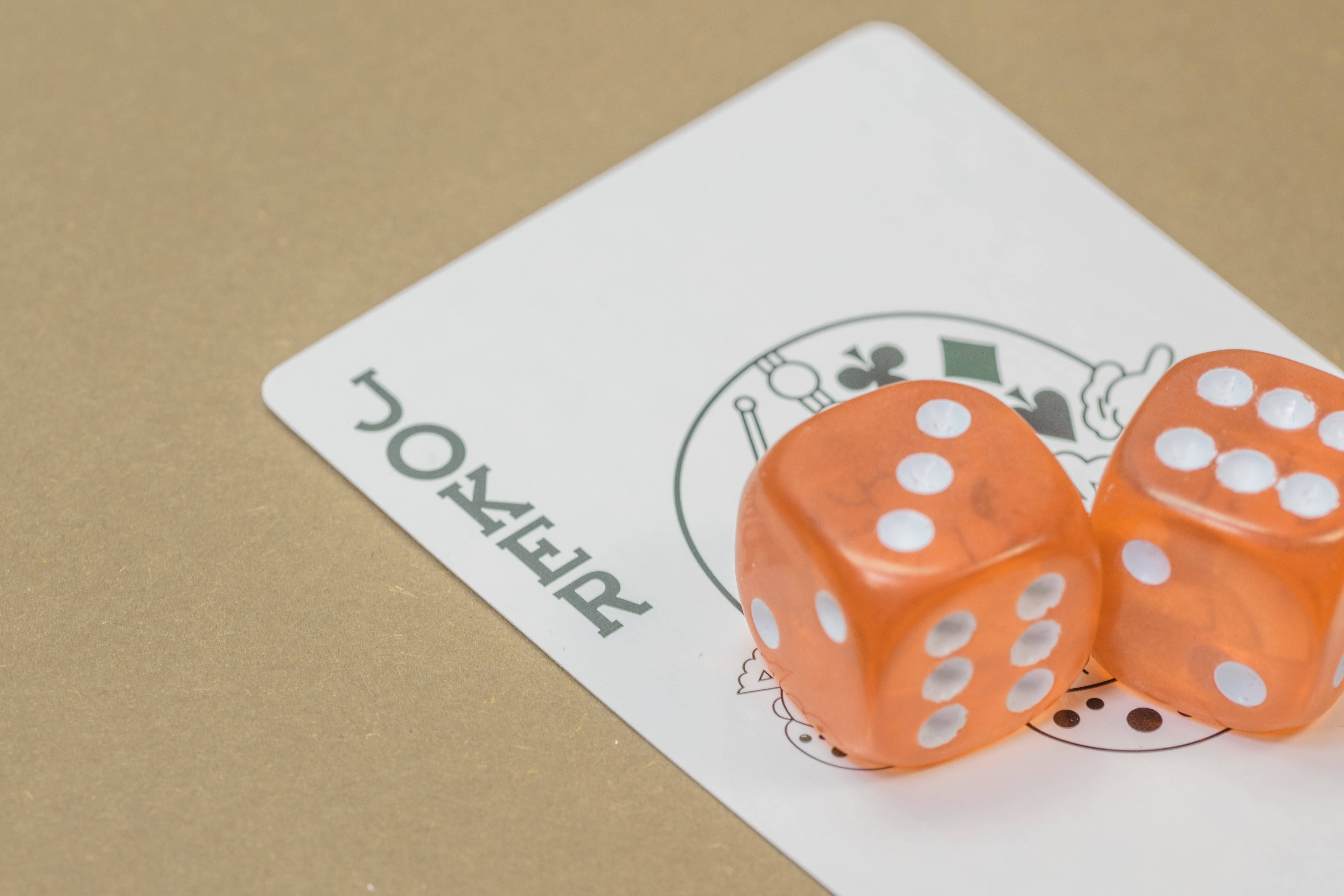 two dice joker playing cards, translucent orange dice, white poker card, 4K Desktop Wallpaper