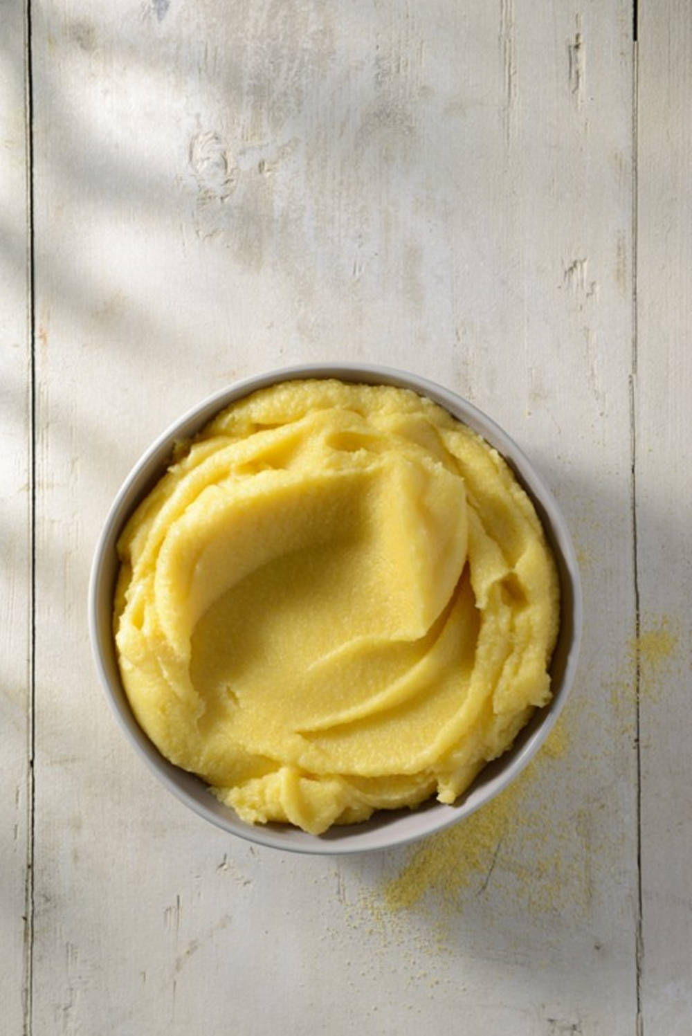 creamy yellow polenta, weathered white wooden surface, soft natural light, HD Phone Wallpaper