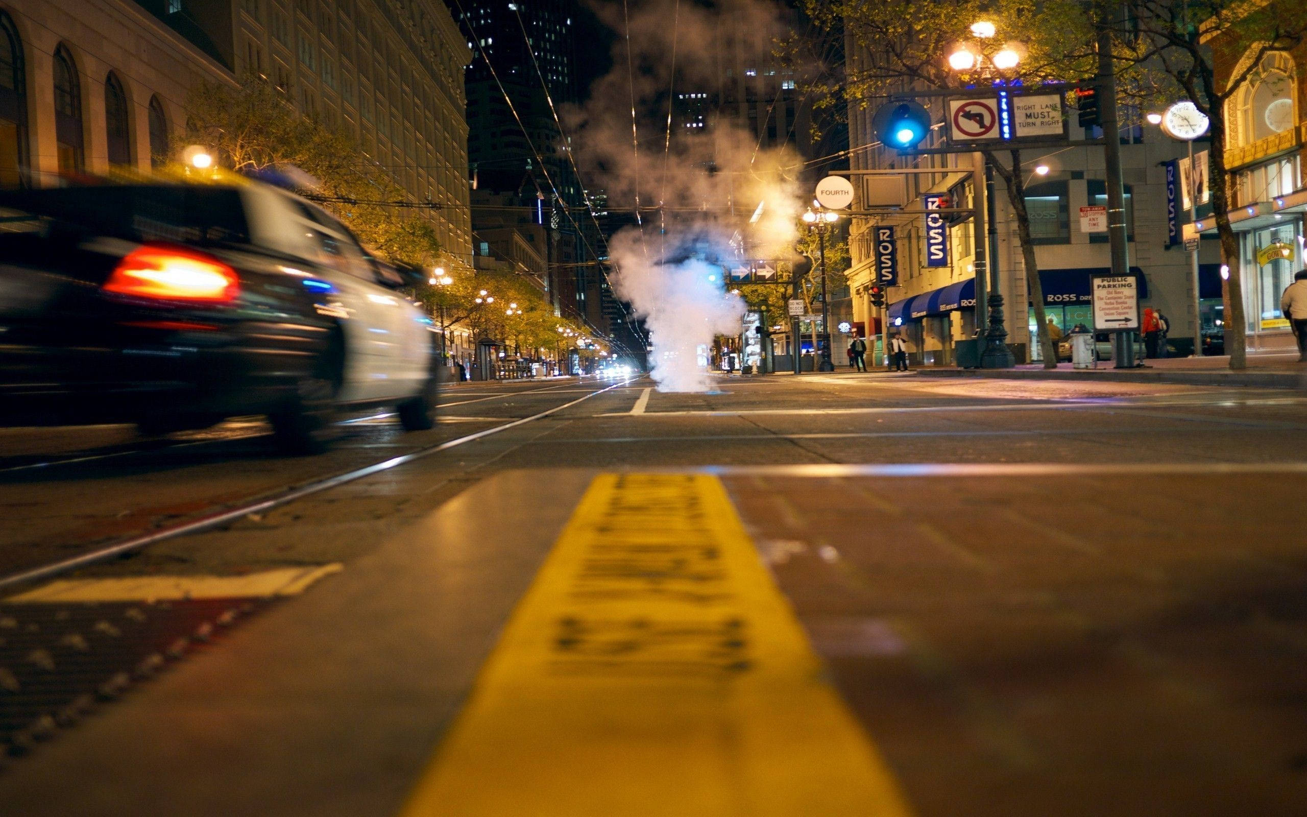police car, neon-lit city street, night, 2K Desktop Wallpaper