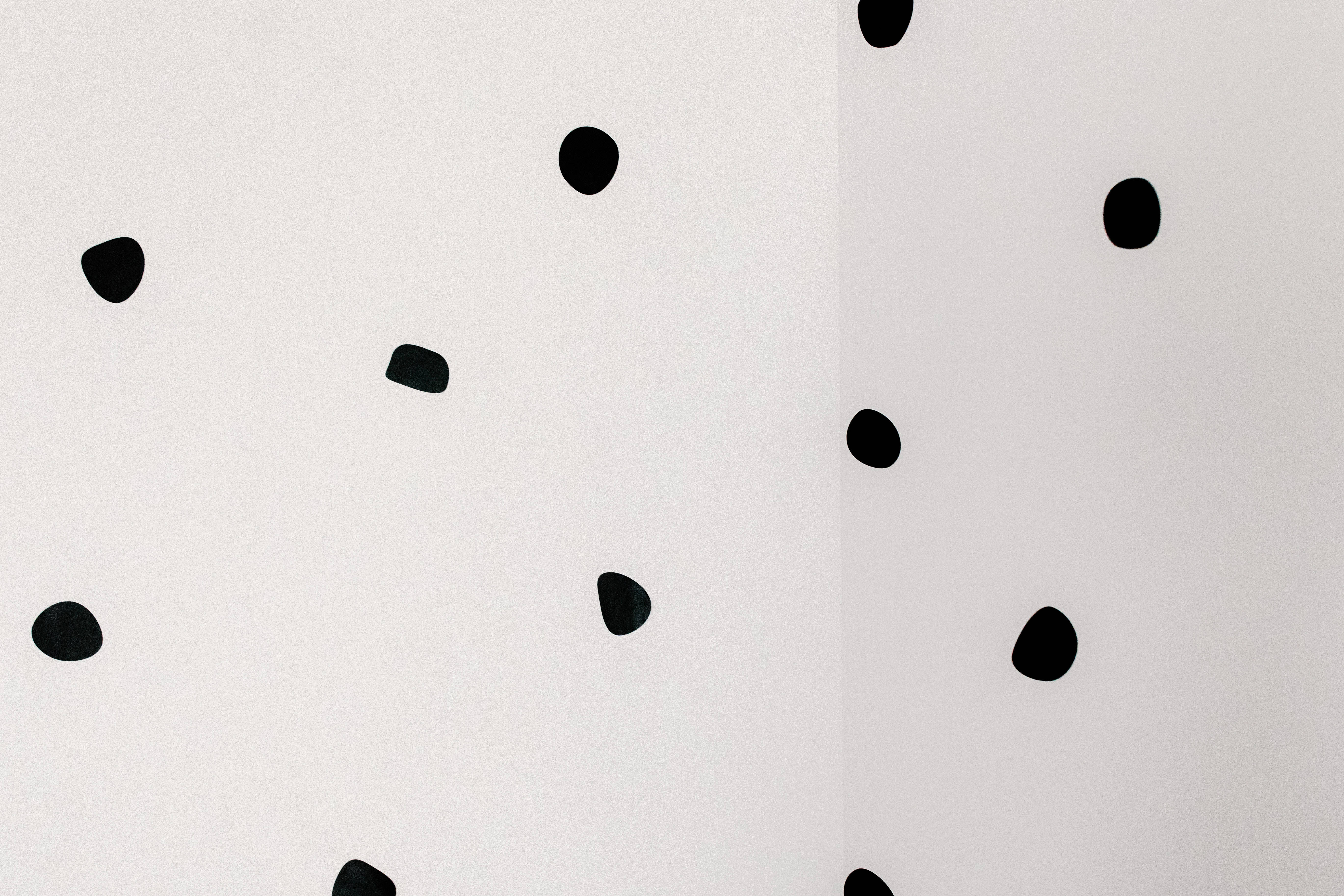 Uneven Black Dot iPhone, minimalist white wall, scattered black abstract dots, 5K Desktop Wallpaper