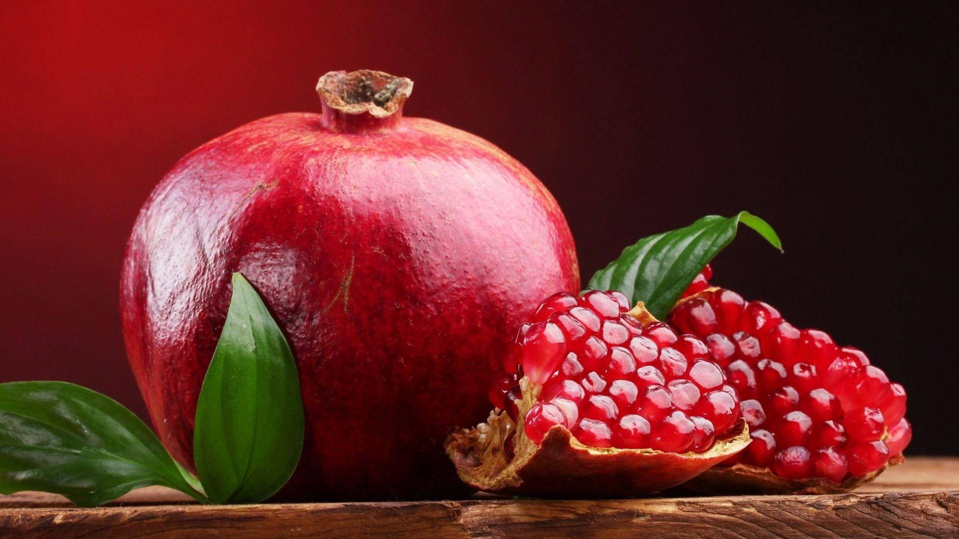 pomegranate fruit, juicy arils, green leaves, Full HD Desktop Wallpaper