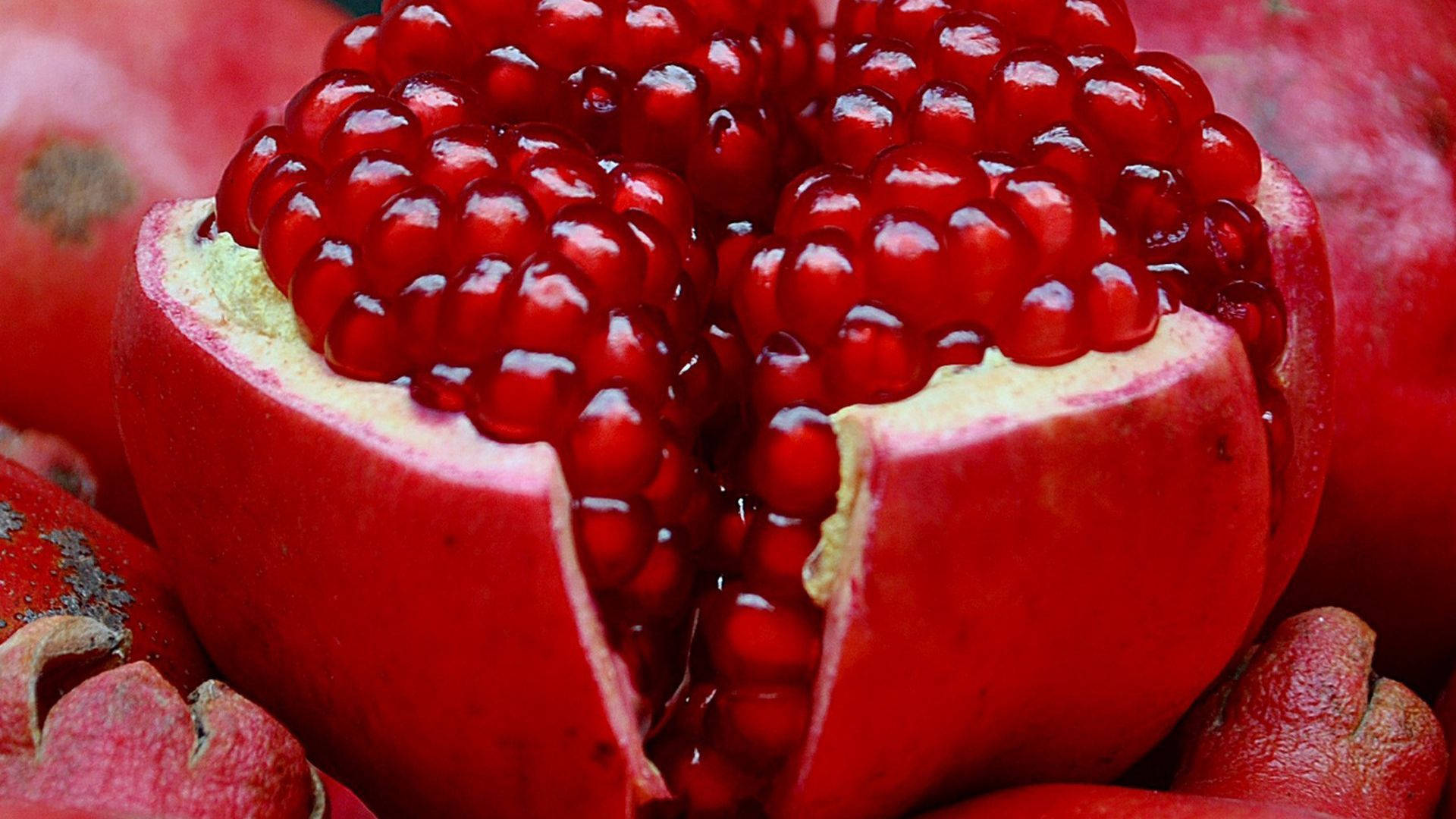 fresh red pomegranate fruit, vibrant red, split open, Full HD Desktop Wallpaper