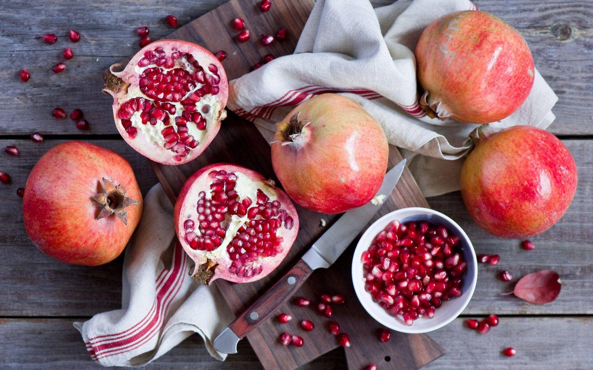 fresh pomegranate fruits, flat lay shot, rustic wooden board, Full HD Desktop Wallpaper