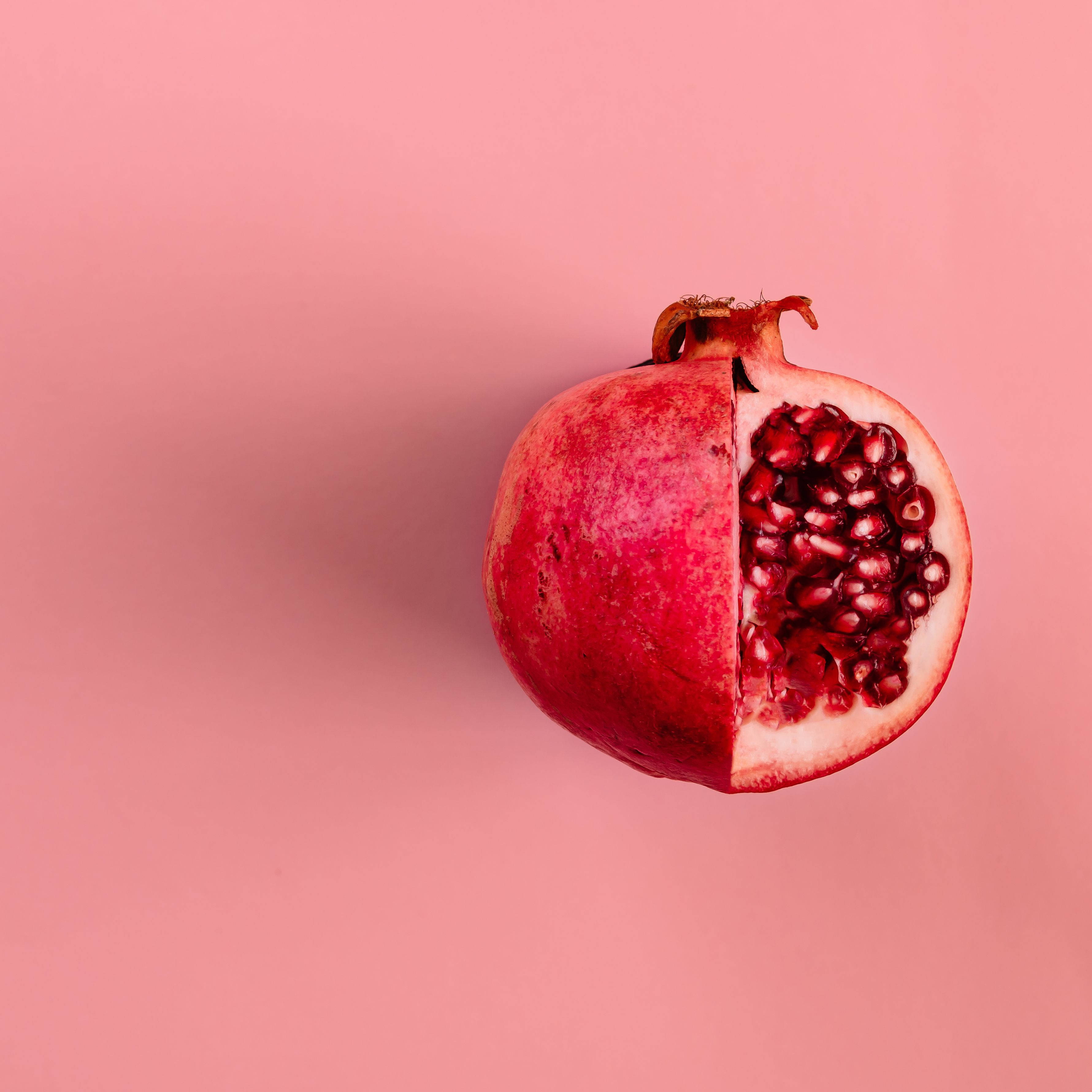 pomegranate, pastel red, soft pink background, 2K Desktop Wallpaper