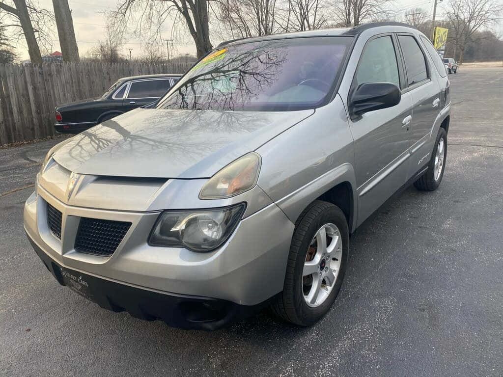 Silver Pontiac Aztek, asphalt, bare trees, SD Desktop Wallpaper