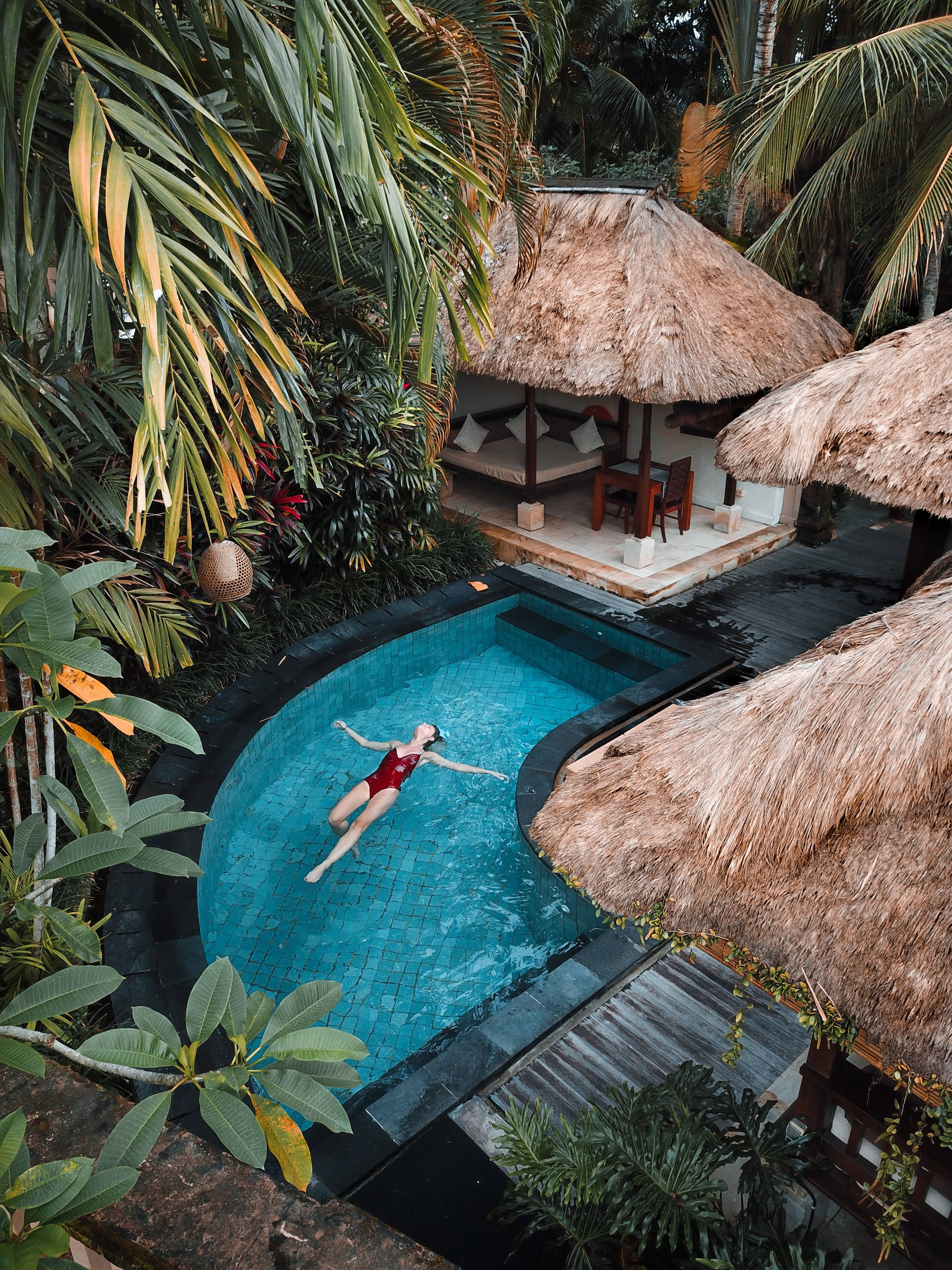 travel 4k hidden pool, curved turquoise pool, lush tropical foliage, 4K Phone Wallpaper