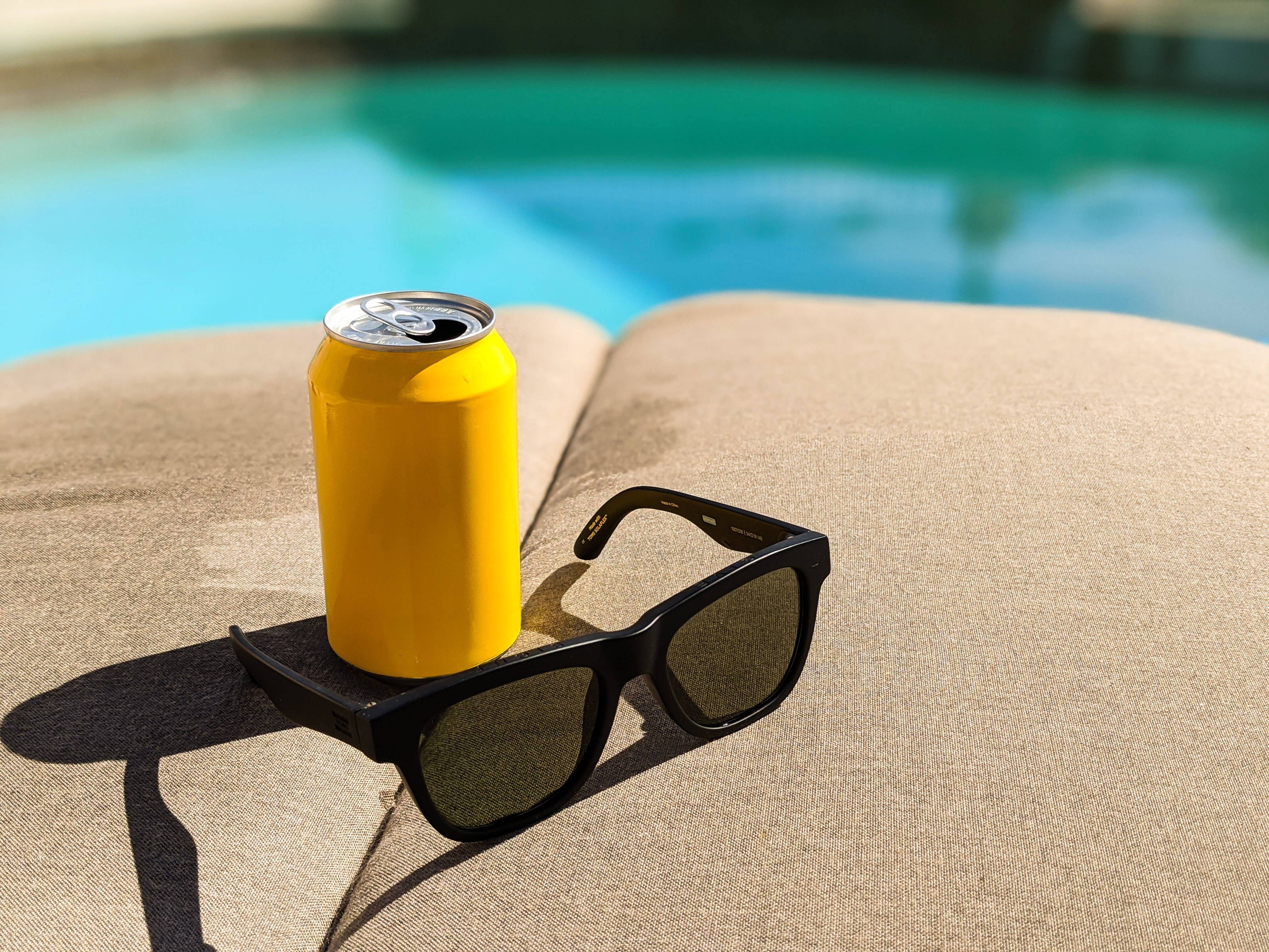 yellow soda can, black sunglasses, beige lounge chair, 4K Desktop Wallpaper