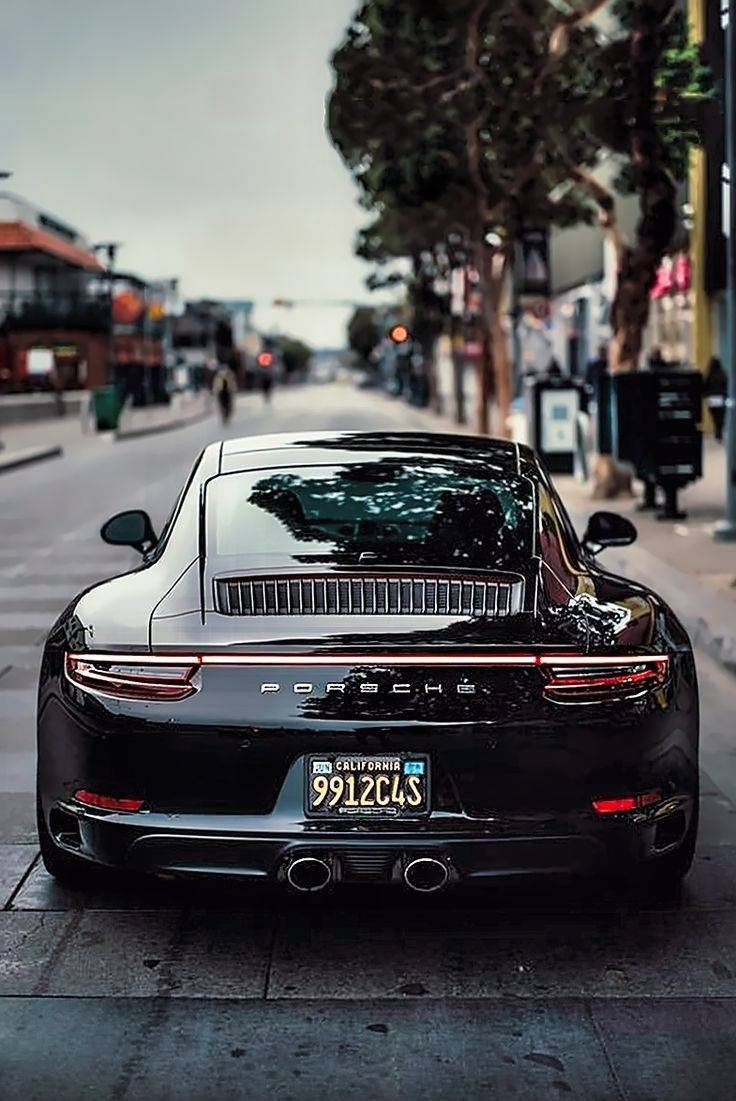 Porsche 911, black, tree-lined urban street, SD Phone Wallpaper