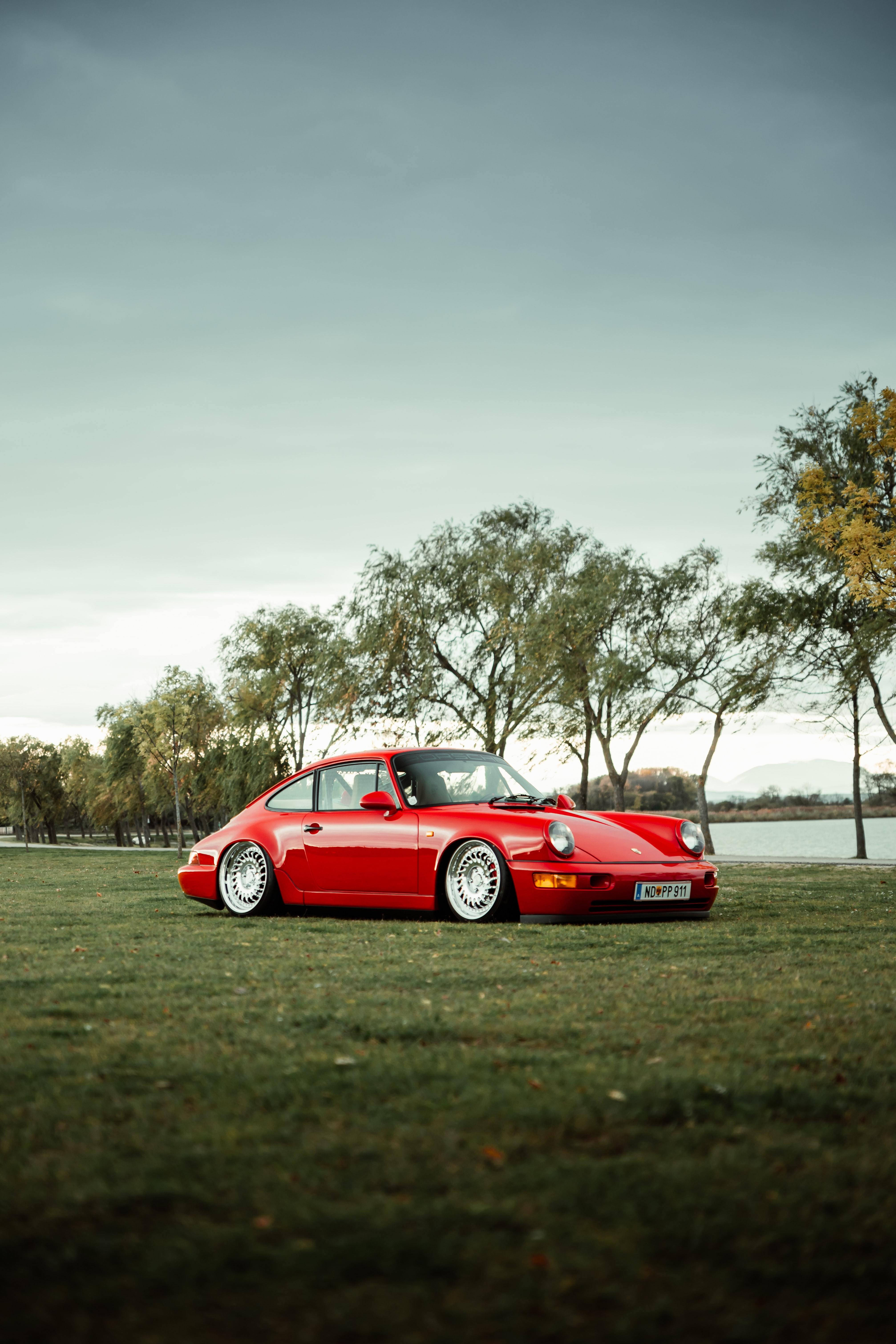 Porsche 911, red, grassy field, 5K Phone Wallpaper