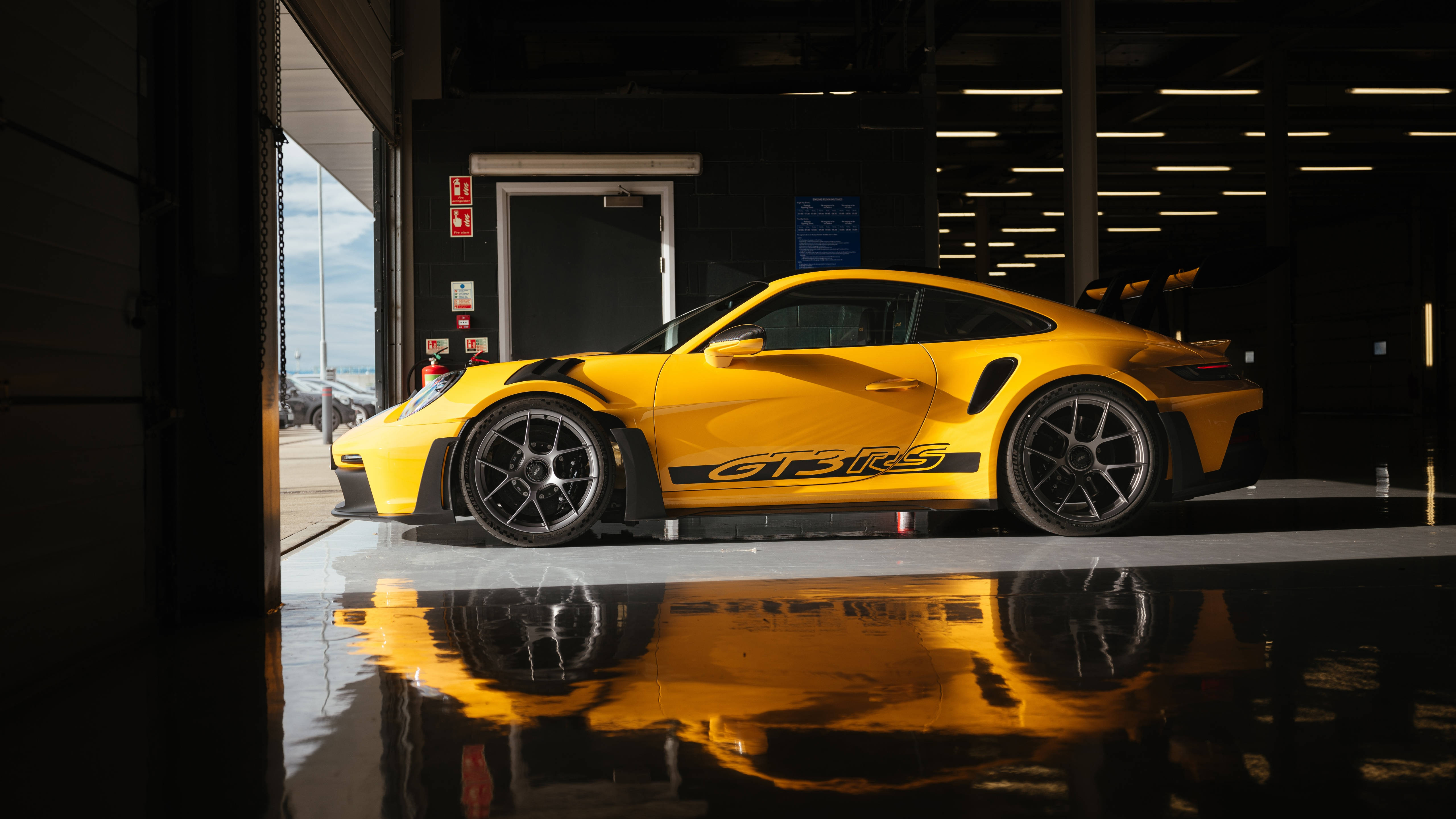 Porsche 911 GT3 RS, vibrant yellow, garage lights, 5K Desktop Wallpaper