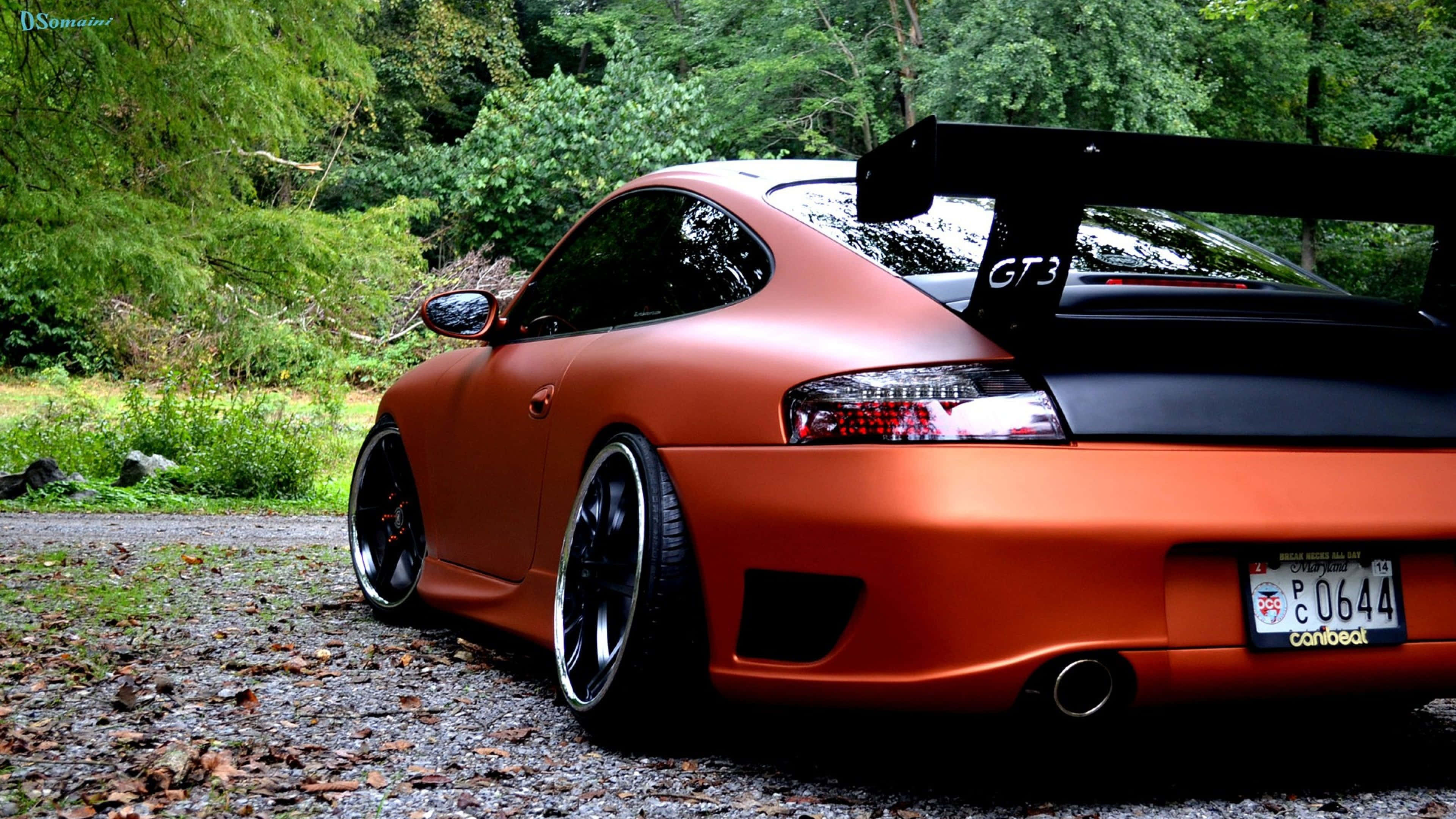 Porsche 911 GT3, matte orange, black rear wing, 4K Desktop Wallpaper