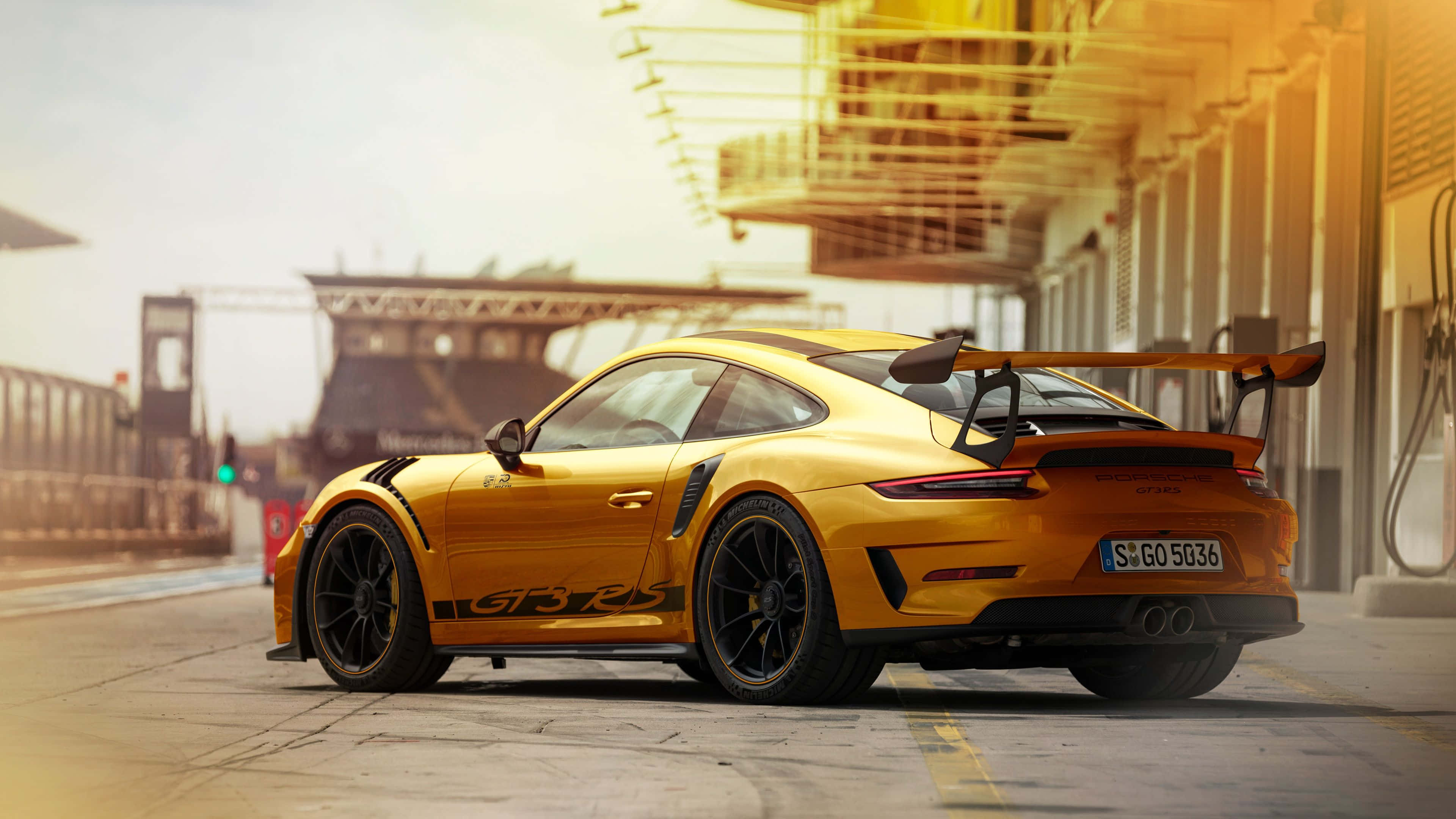 Porsche 911 GT3 RS, yellow sunset, black accents, 4K Desktop Wallpaper