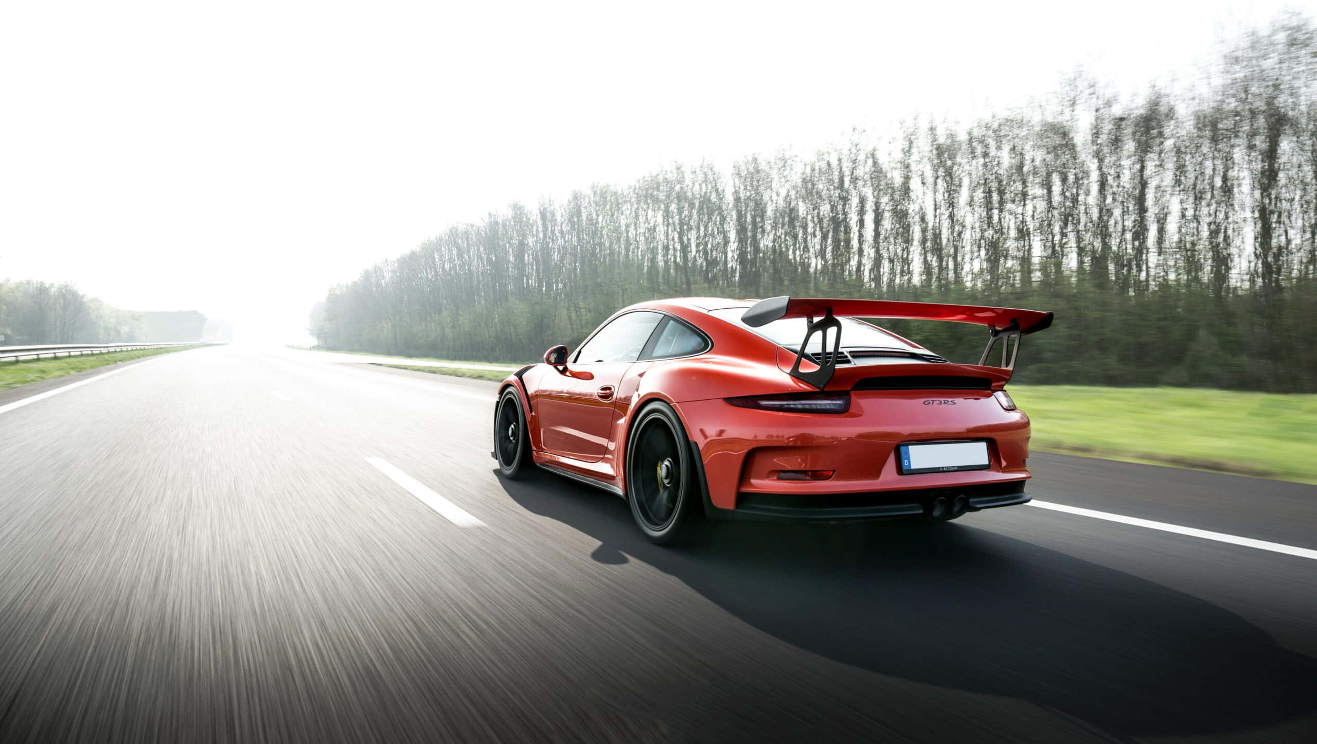 Porsche 911 GT3 RS, vibrant red, sunlit highway, 2K Desktop Wallpaper