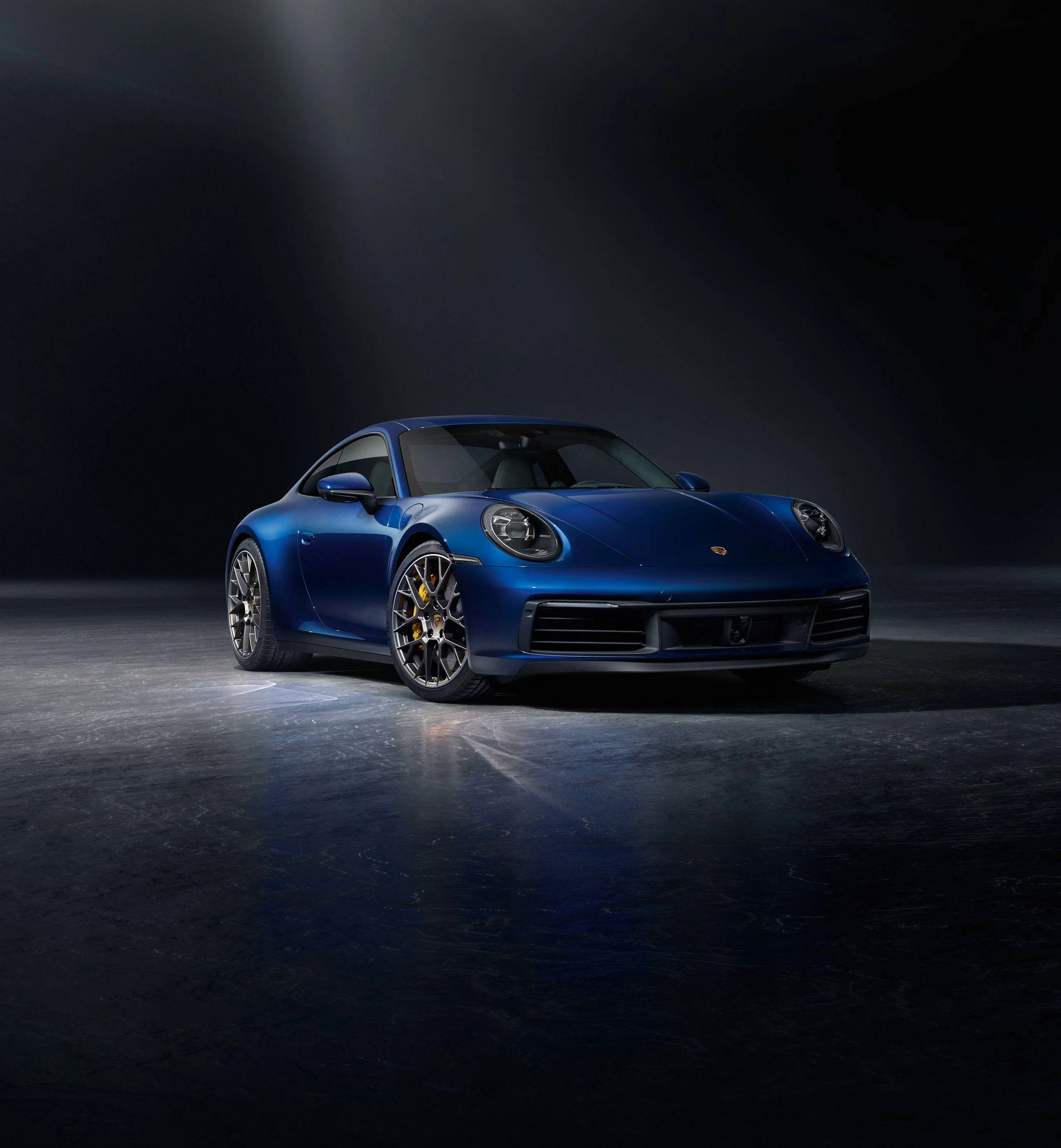 blue Porsche 911, dark room, single spotlight, 2K Phone Wallpaper