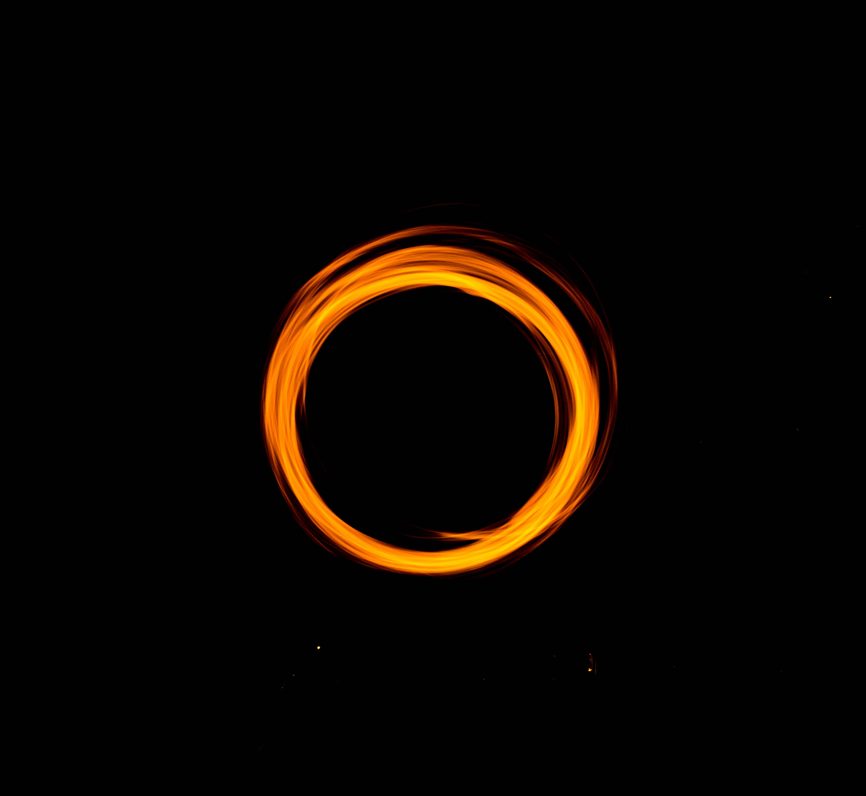 orange circle portal, glowing orange light trail, pitch black background, 2K Desktop Wallpaper