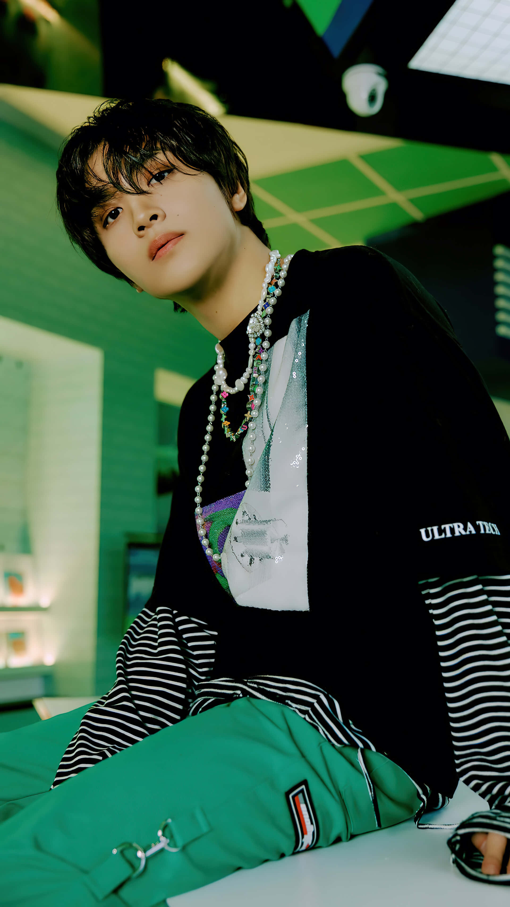 Portrait Mode, neon green room, layered black and striped clothing, 4K Phone Wallpaper