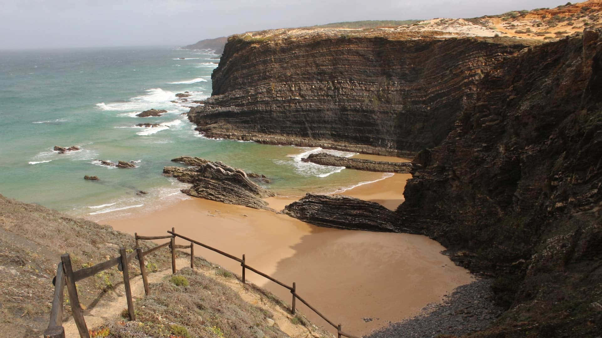 Portuguese Beach, golden sand, towering layered cliffs, Full HD Desktop Wallpaper