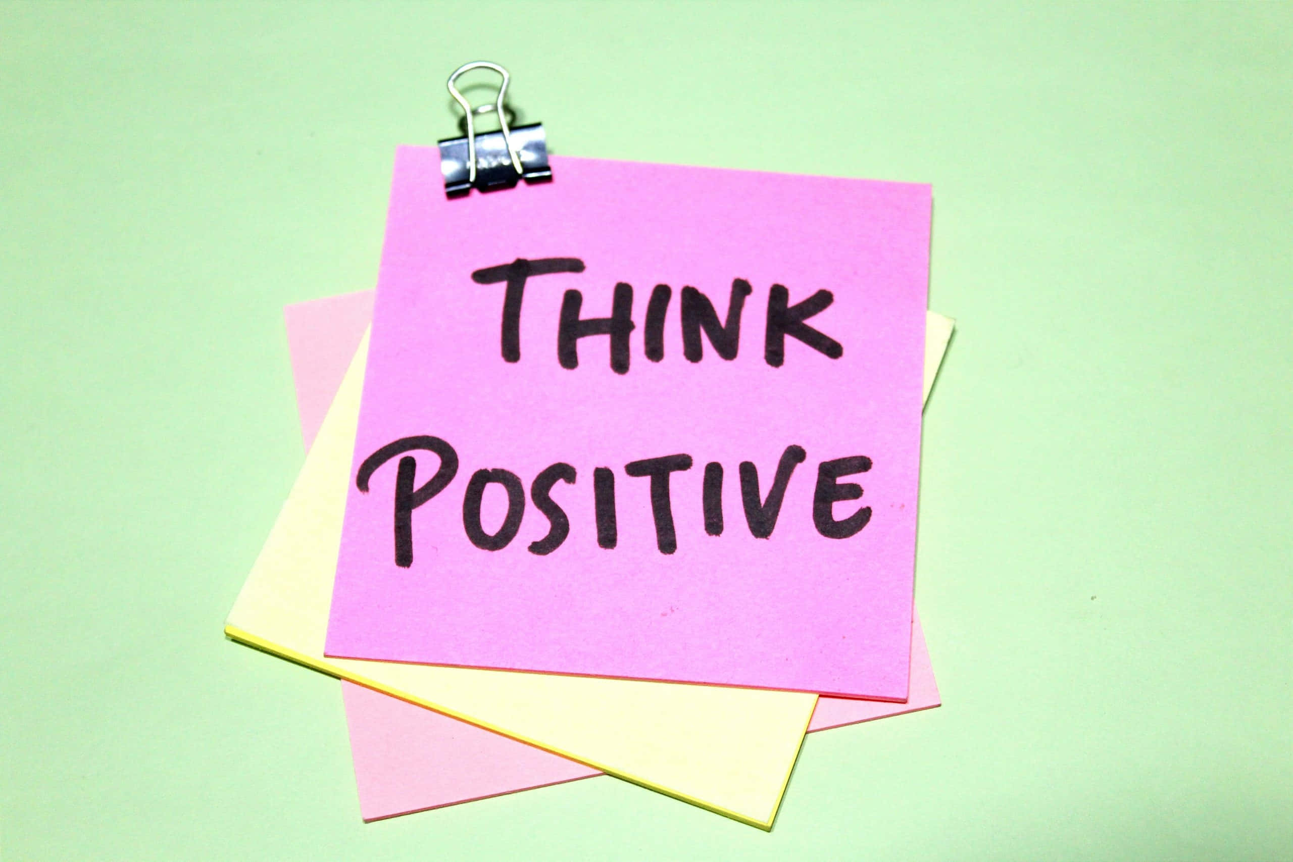 pink sticky note, THINK POSITIVE, bold black handwriting, 2K Desktop Wallpaper