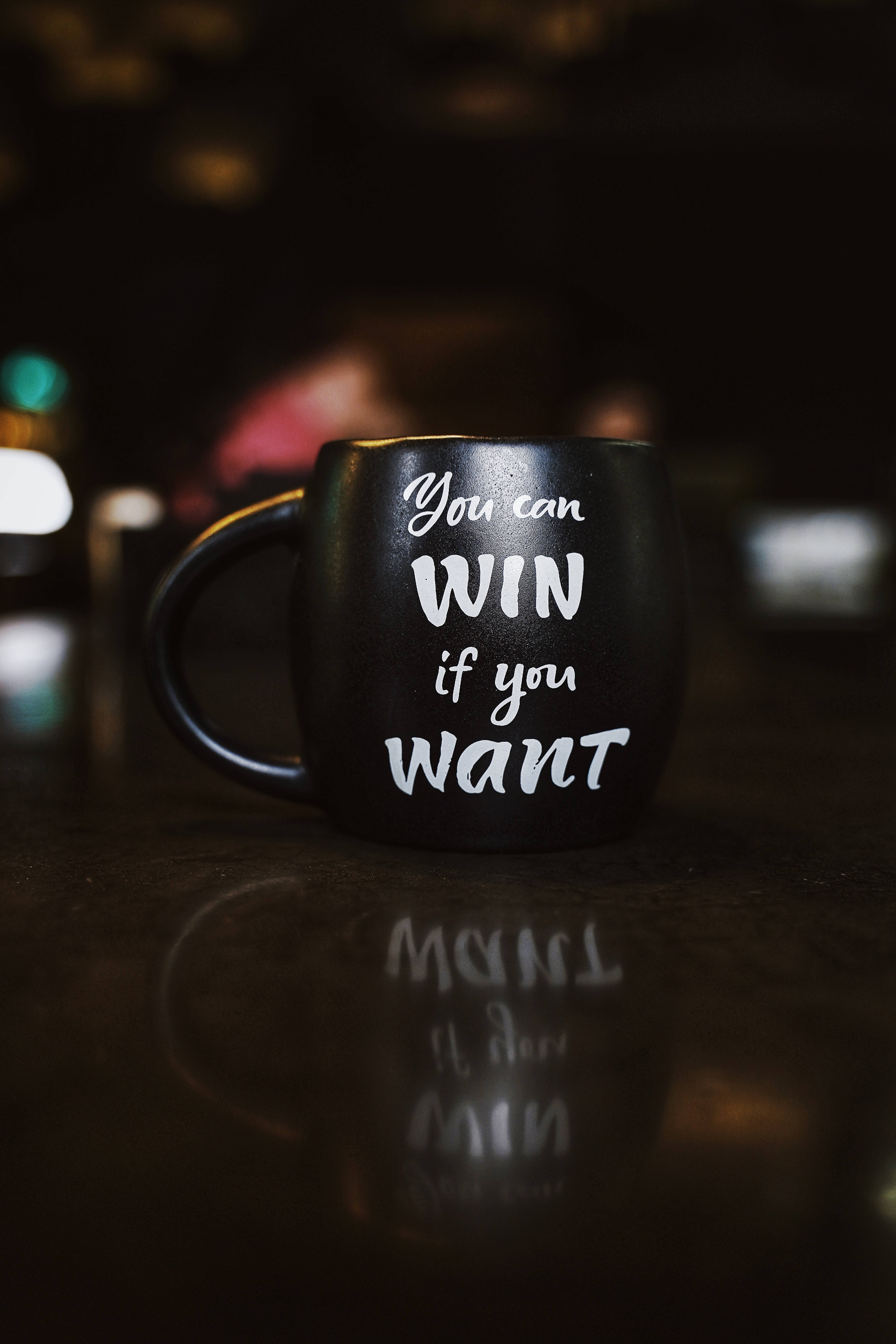 black mug, white motivational text, reflective surface, 5K Phone Wallpaper