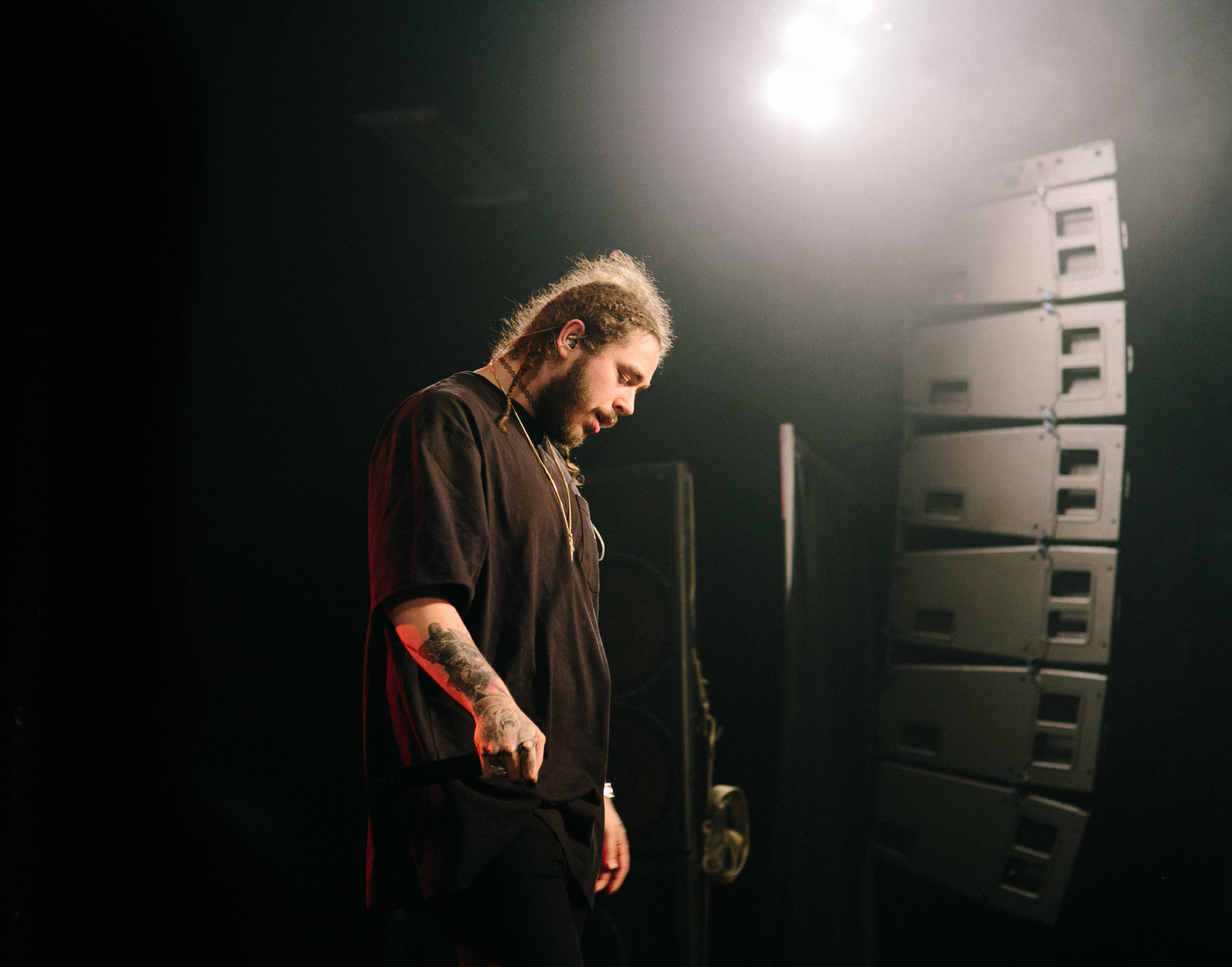 Post Malone, dim concert lighting, bright spotlight, 5K Desktop Wallpaper